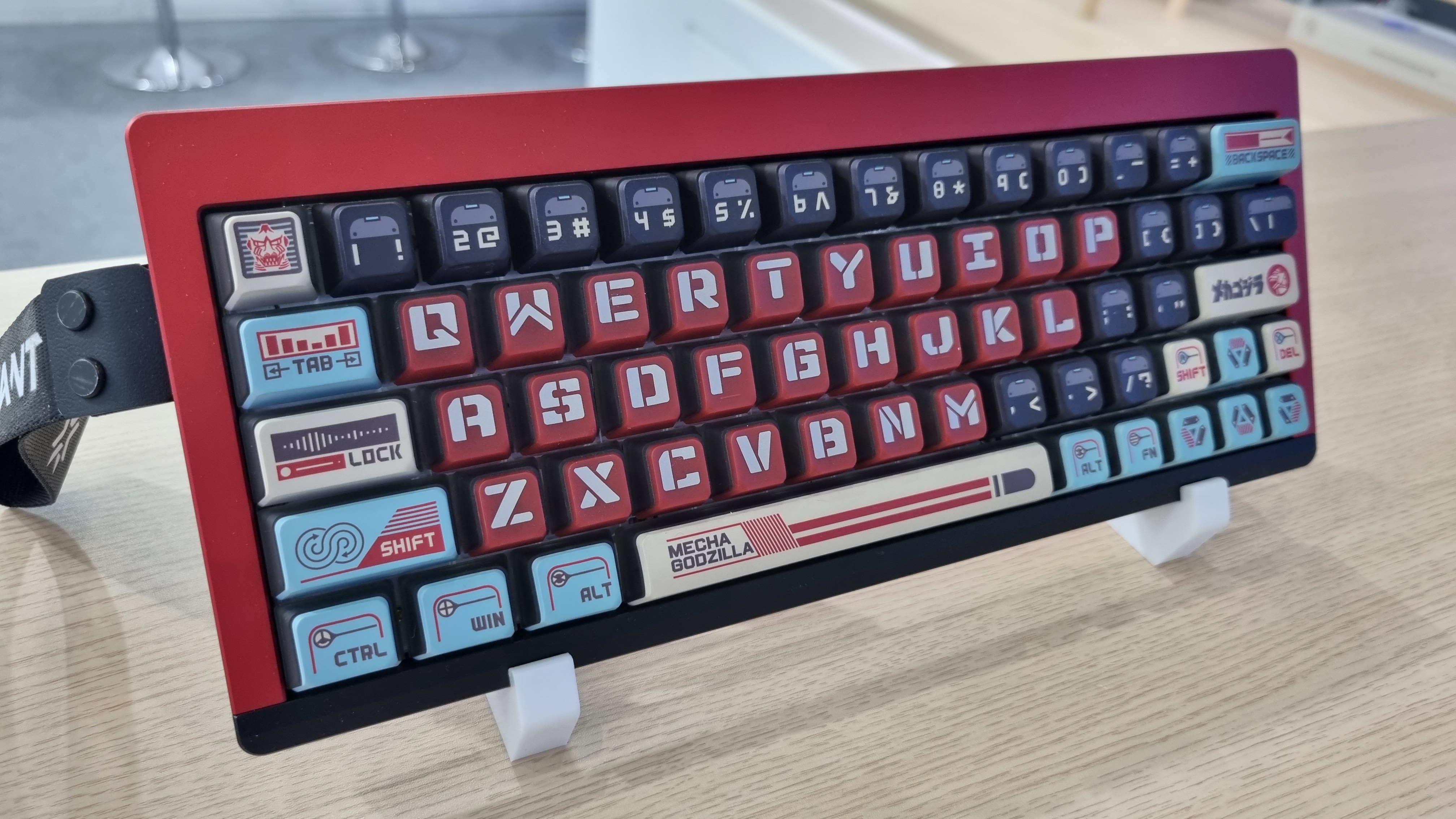 Various custom Godzilla keycaps and boxes at the KeyTok booth, 2025