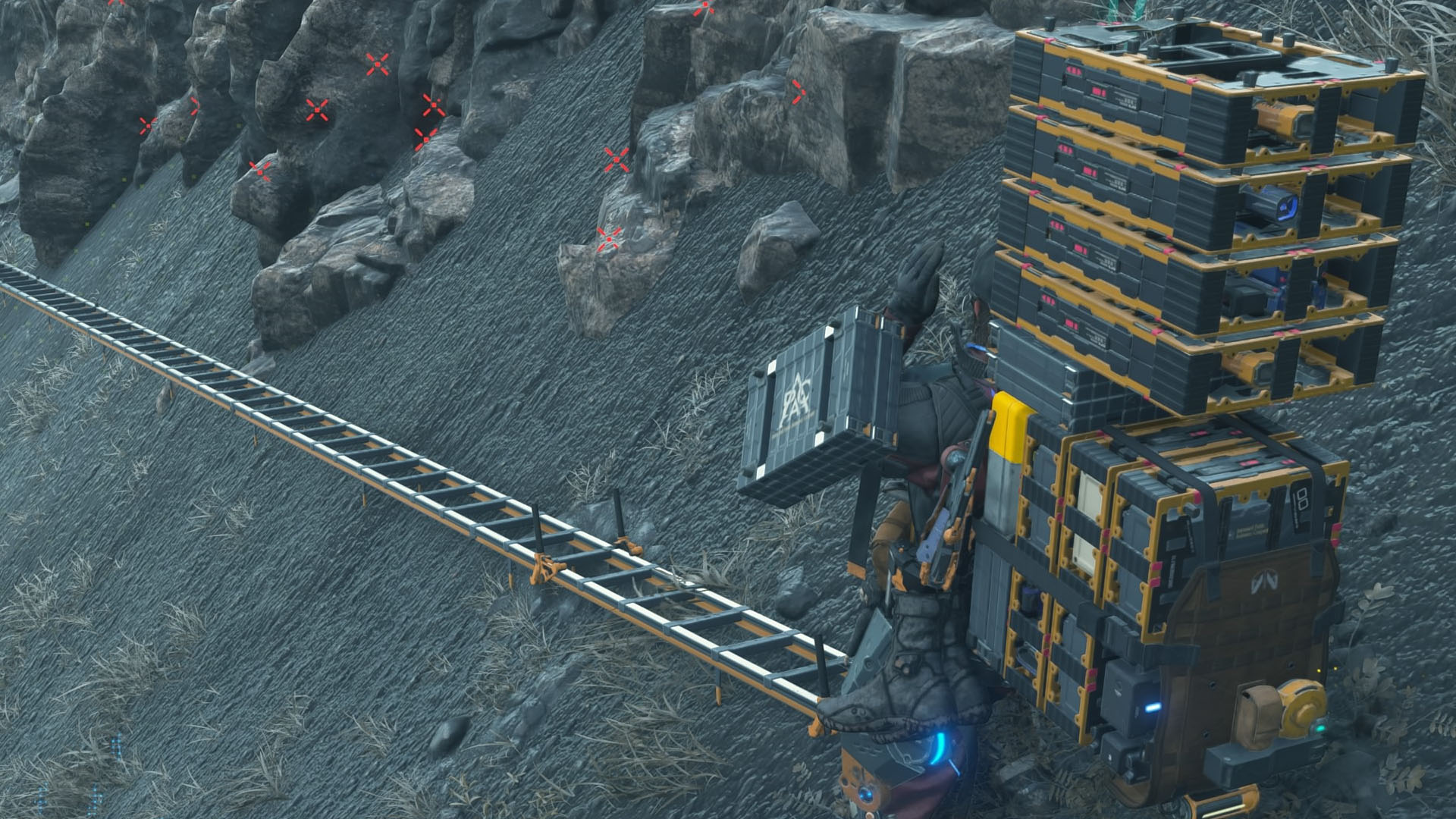 A Death Stranding 2 screenshot showing a character in front of a ladder on the ground. A Death Stranding 2 screenshot showing a character in front of a ladder on the ground.