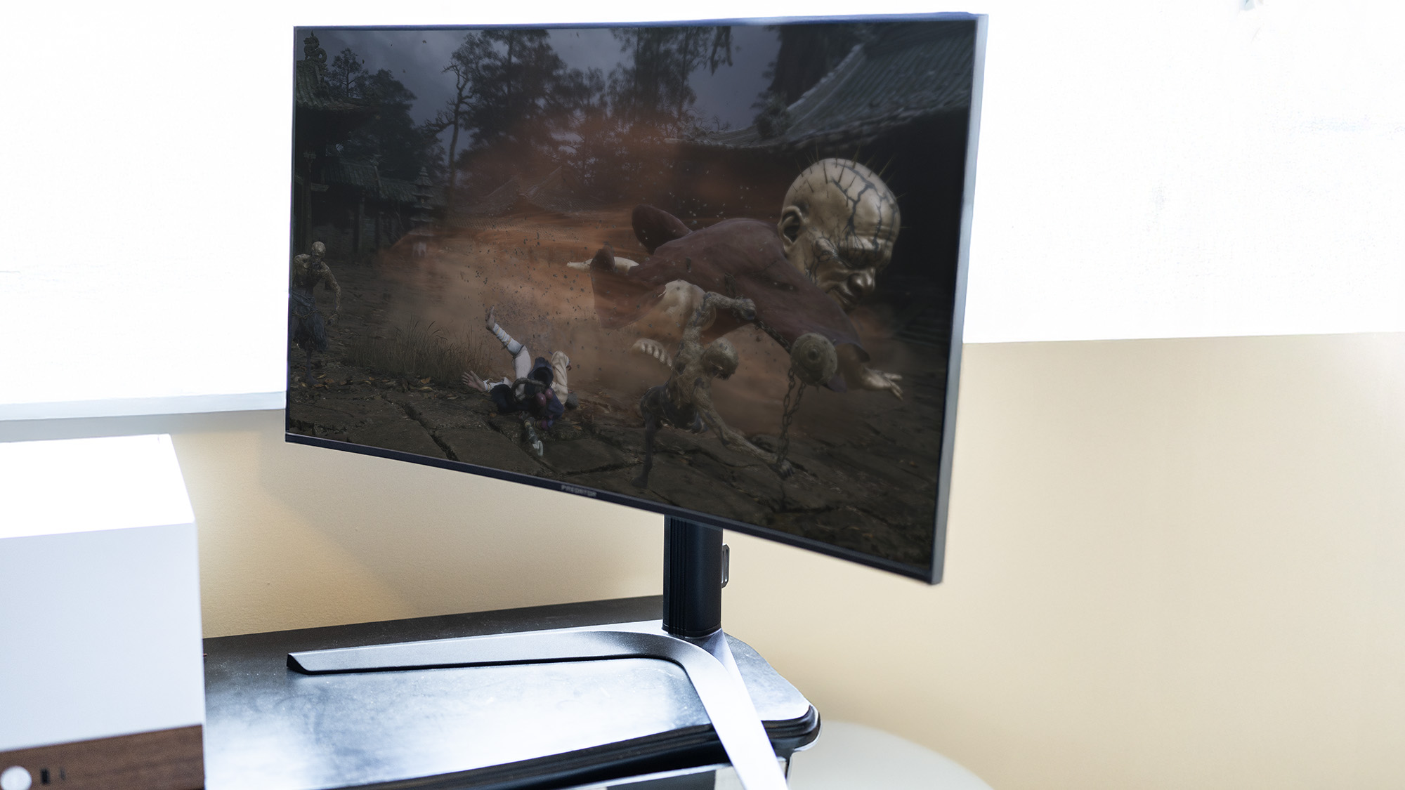An Acer Predator X32X gaming monitor set up on a desk.