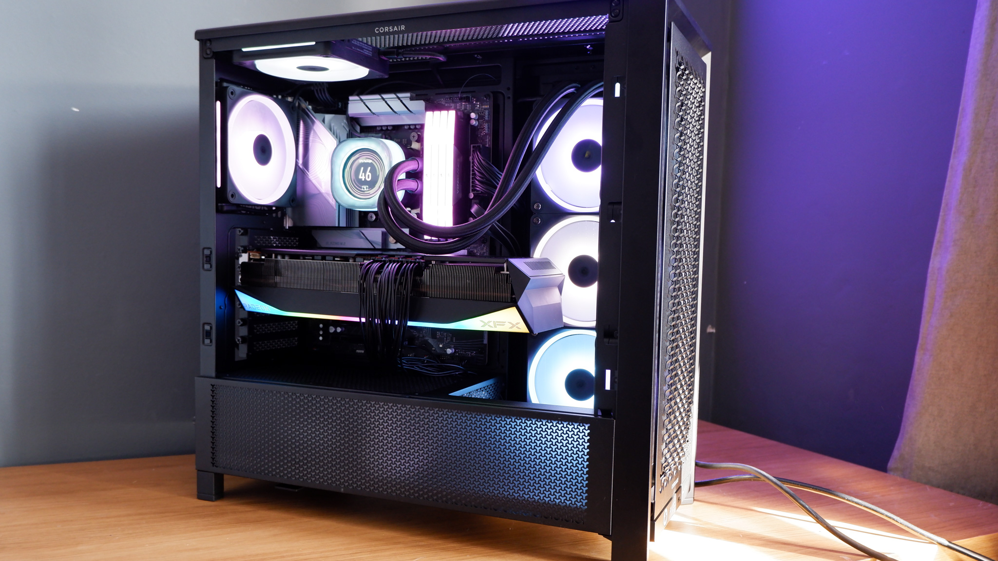 Corsair iCUE Link Titan 360 RX LCD liquid cooler set up on a test bench.