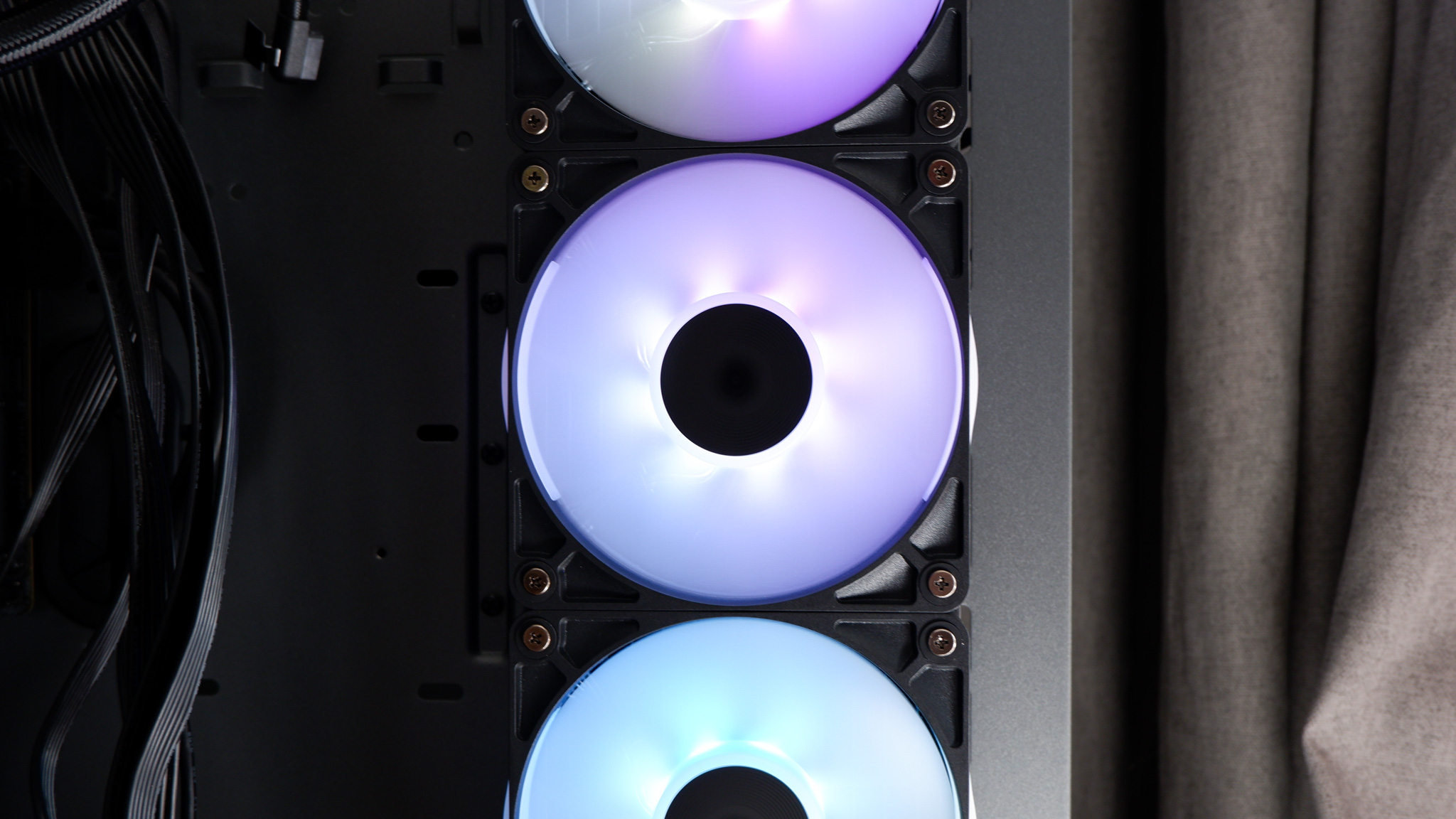 Corsair iCUE Link Titan 360 RX LCD liquid cooler set up on a test bench.