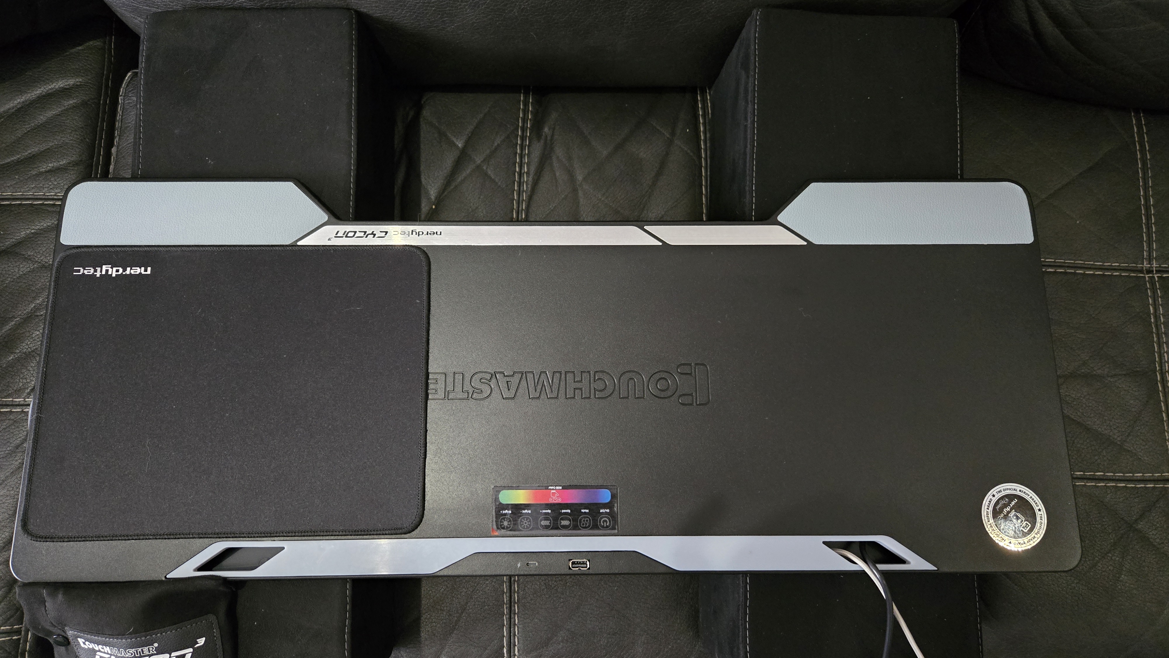 Couchmaster Cycon3 set-up on a sofa with a keyboard and mouse.