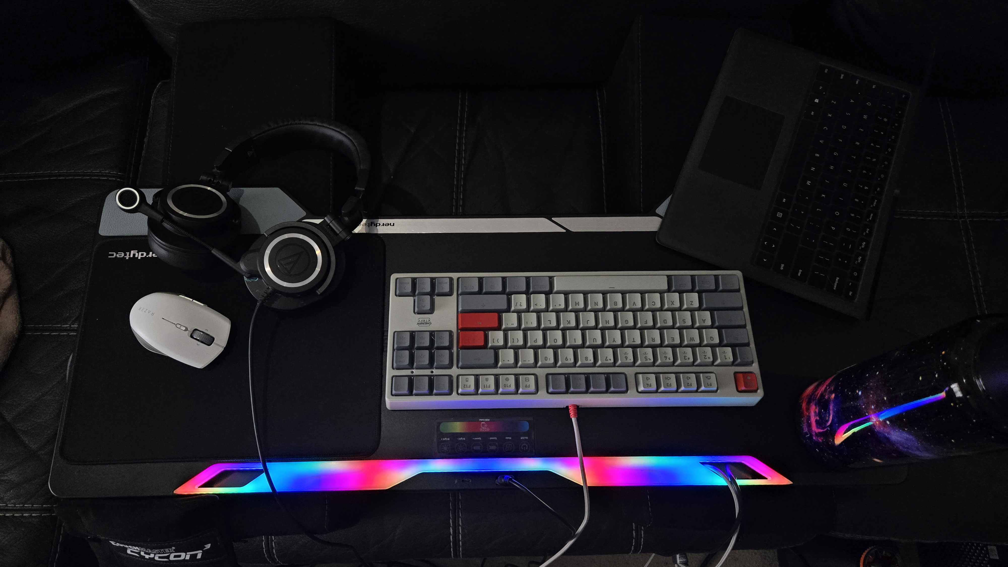 Couchmaster Cycon3 set-up on a sofa with a keyboard and mouse.