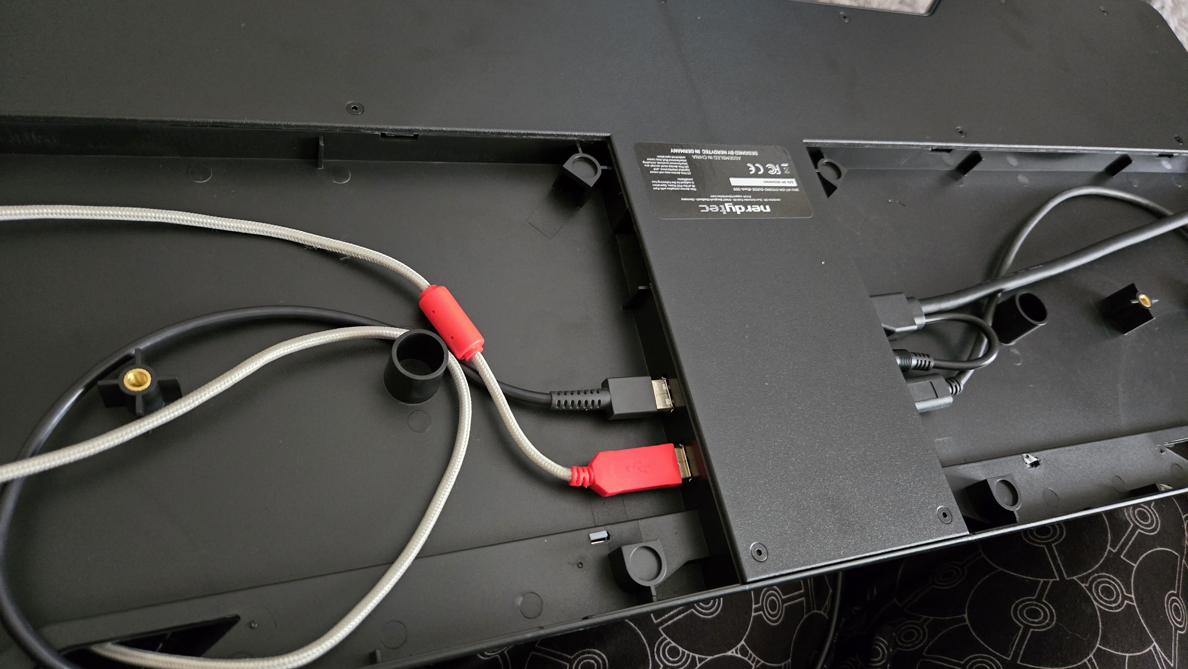 Couchmaster Cycon3 set-up on a sofa with a keyboard and mouse.