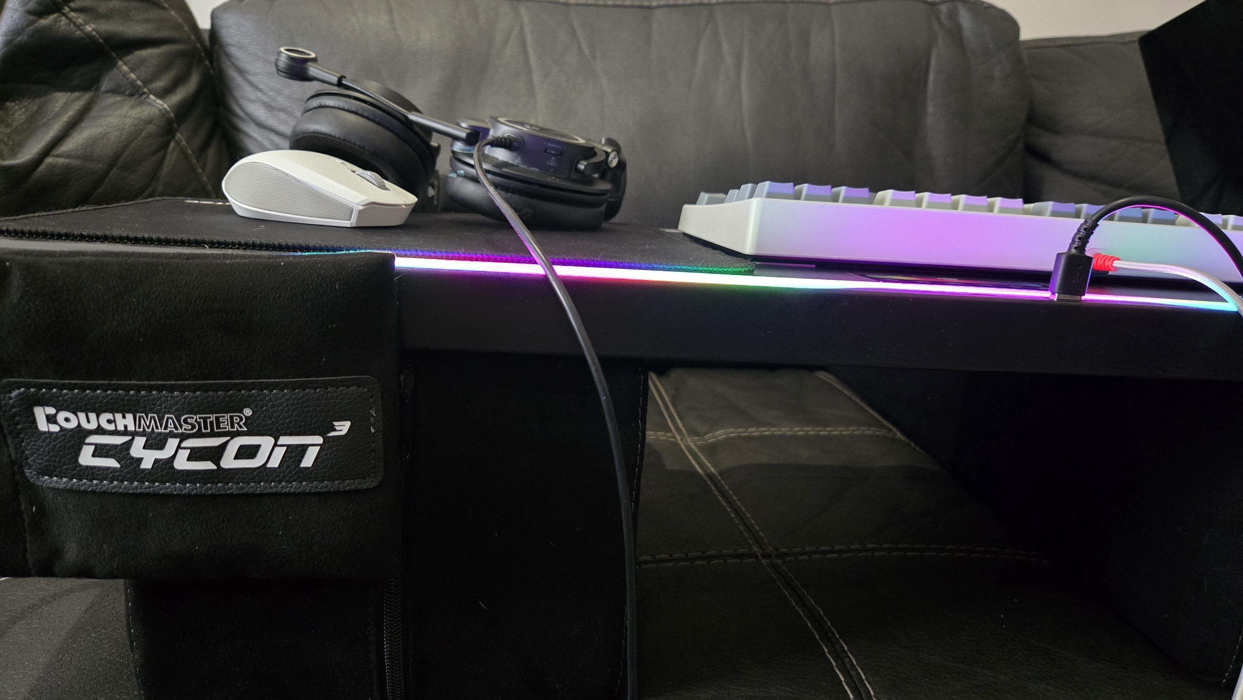 Couchmaster Cycon3 set-up on a sofa with a keyboard and mouse.