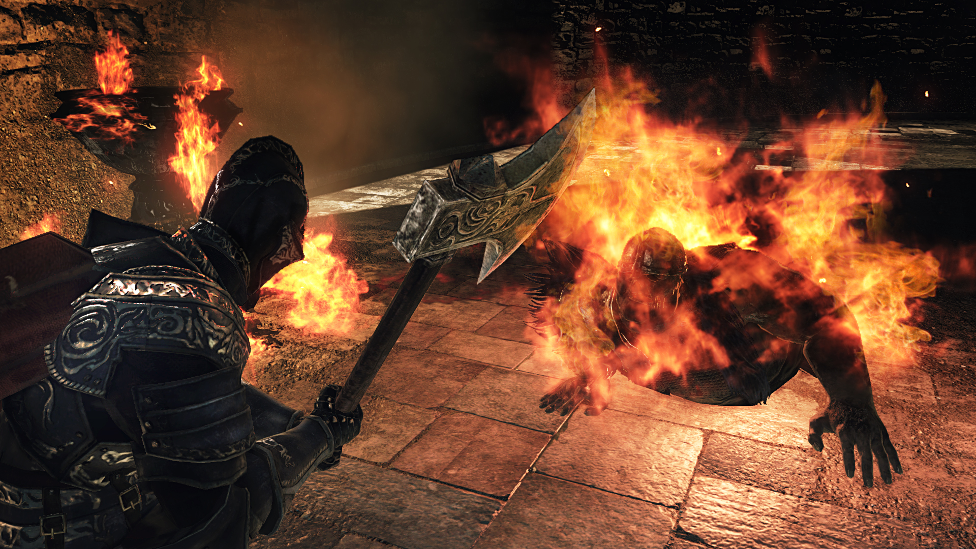 A flaming enemy crawls toward the player in Dark Souls 2.