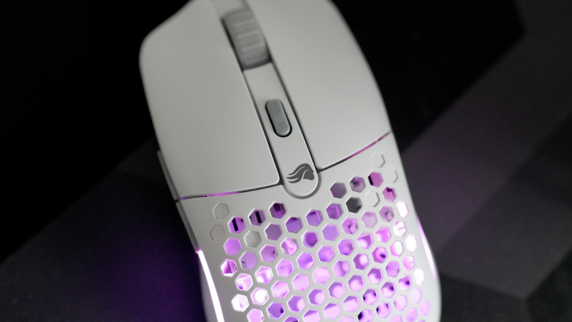 A Glorious Model O Eternal gaming mouse on a mouse mat with the lighting enabled.