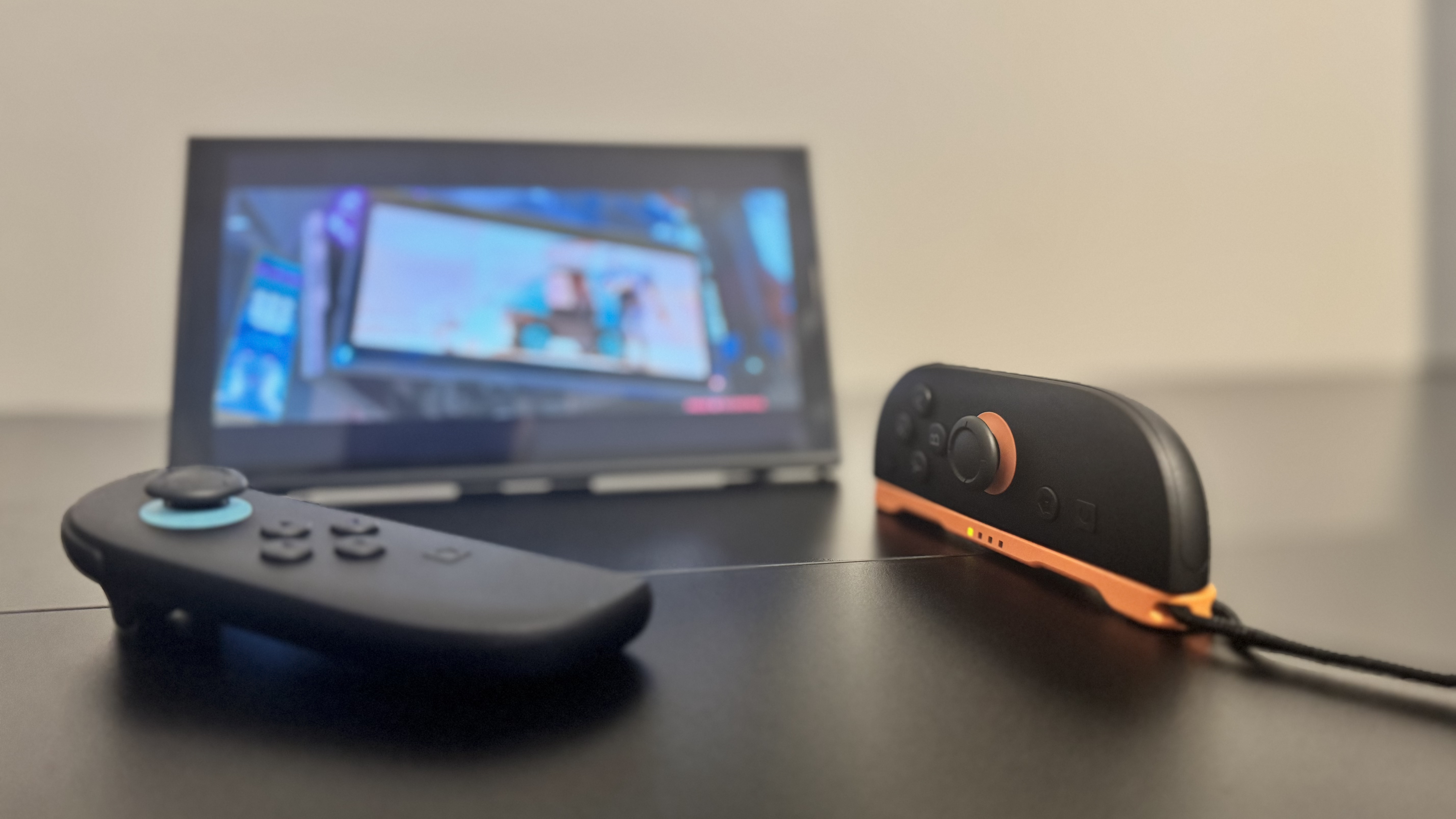 A picture of a Nintendo Switch 2, in mouse mode, with Cyberpunk 2077 in the background