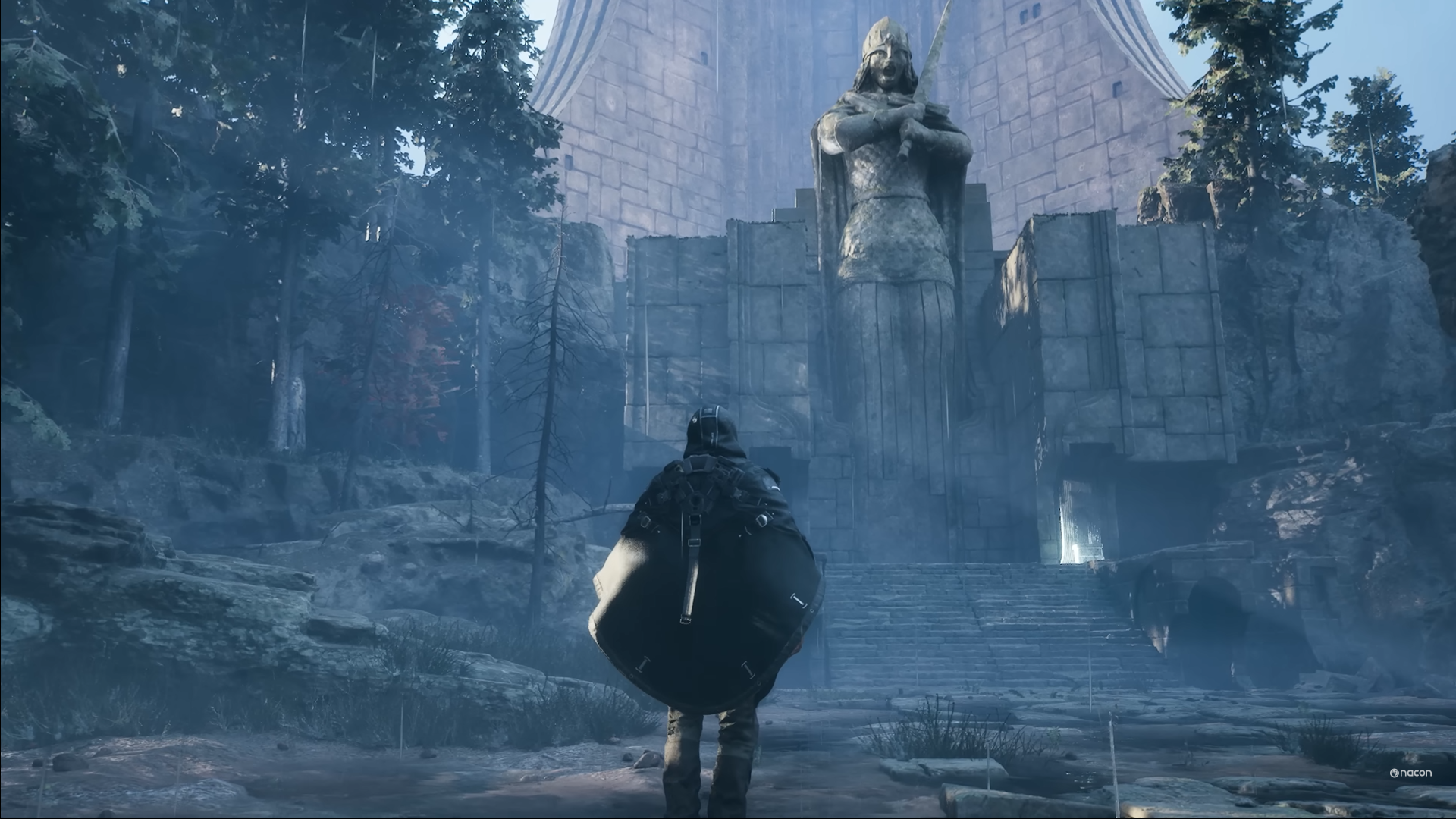 The player character wearing a cloak, explores a bleak ruin in Hell Is Us