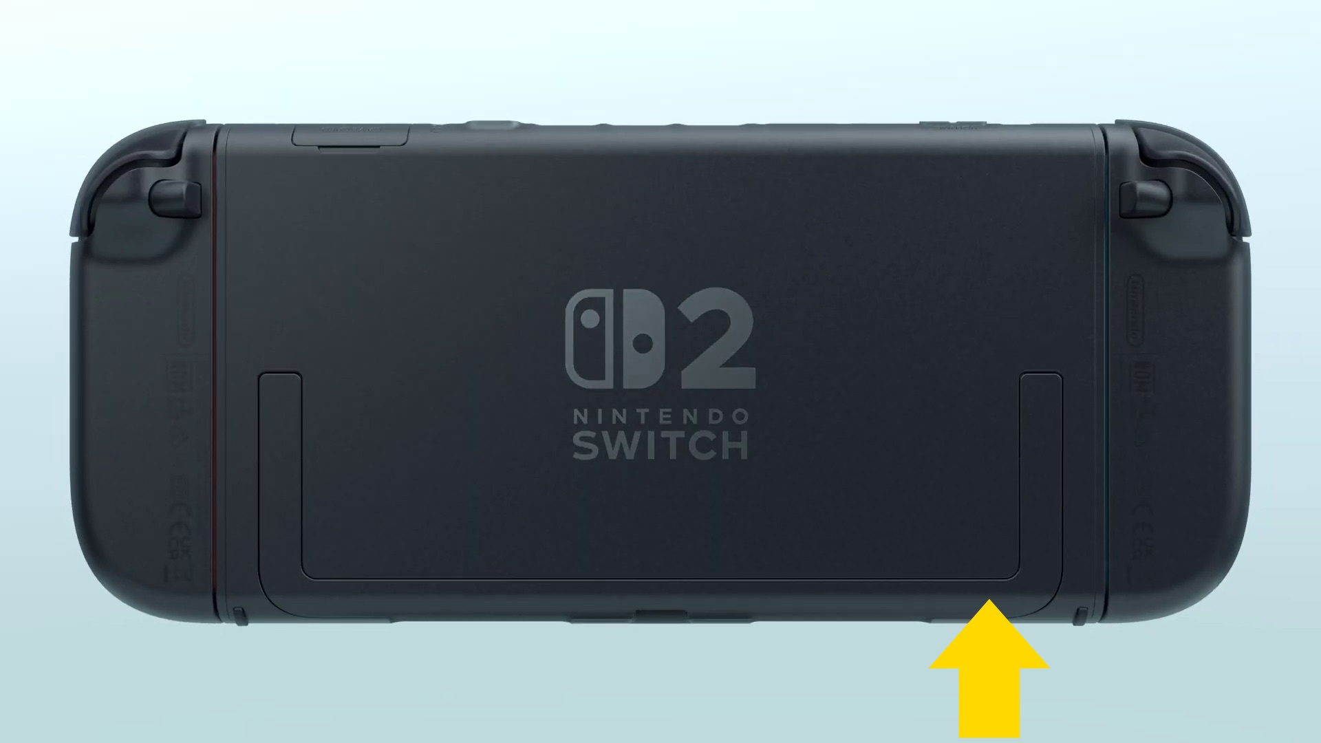 The back of a Switch 2 unit with a yellow arrow pointing to where the microSD Express card slot is The back of a Switch 2 unit with a yellow arrow pointing to where the microSD Express card slot is