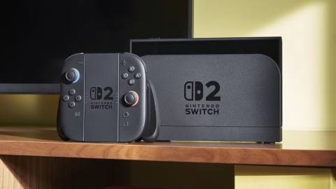 A docked Switch 2 with Joy-Cons in the Joy-Con grip next to it
