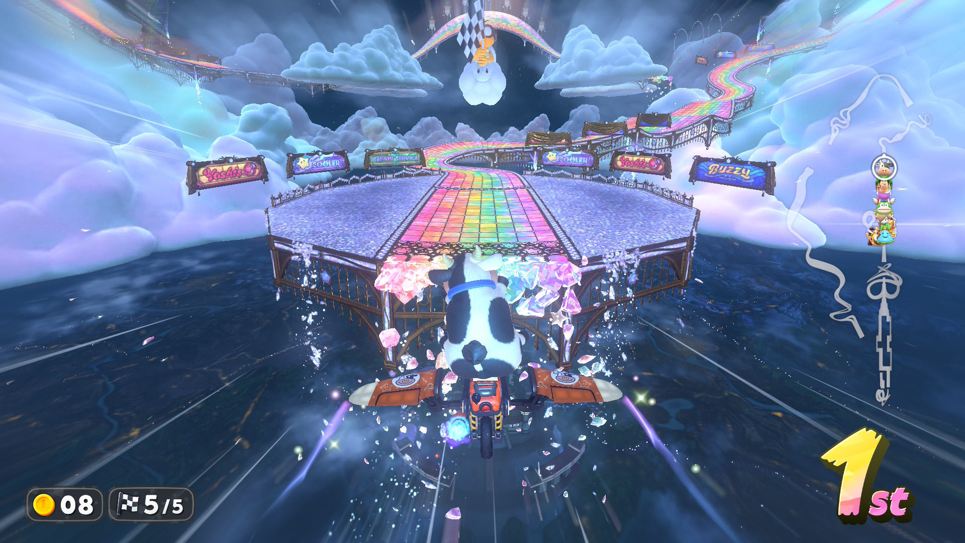 A Mario Kart World screenshot showing the character Cow flying heading toward the Rainbow Road track. A Mario Kart World screenshot showing the character Cow flying heading toward the Rainbow Road track.