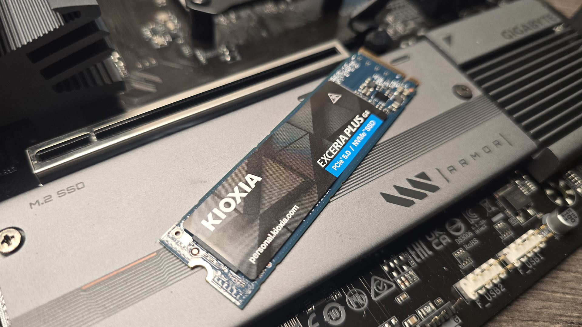 The Kioxia Exceria Plus G4 on a desk, ready to be installed inside a gaming PC.