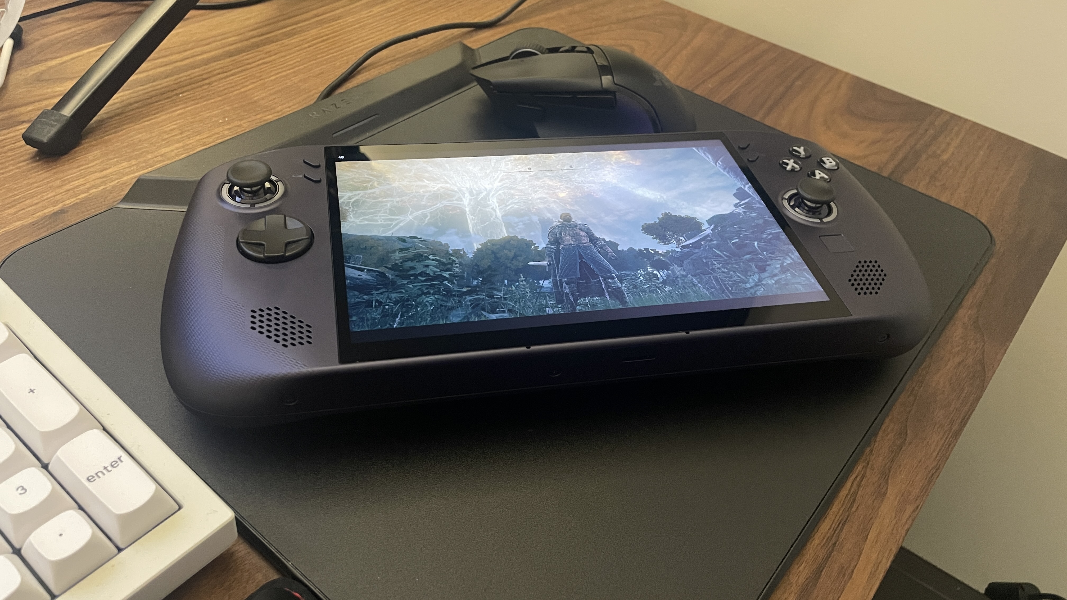 A Lenovo Legion Go S handheld with SteamOS in Nebula Nocturne colour scheme