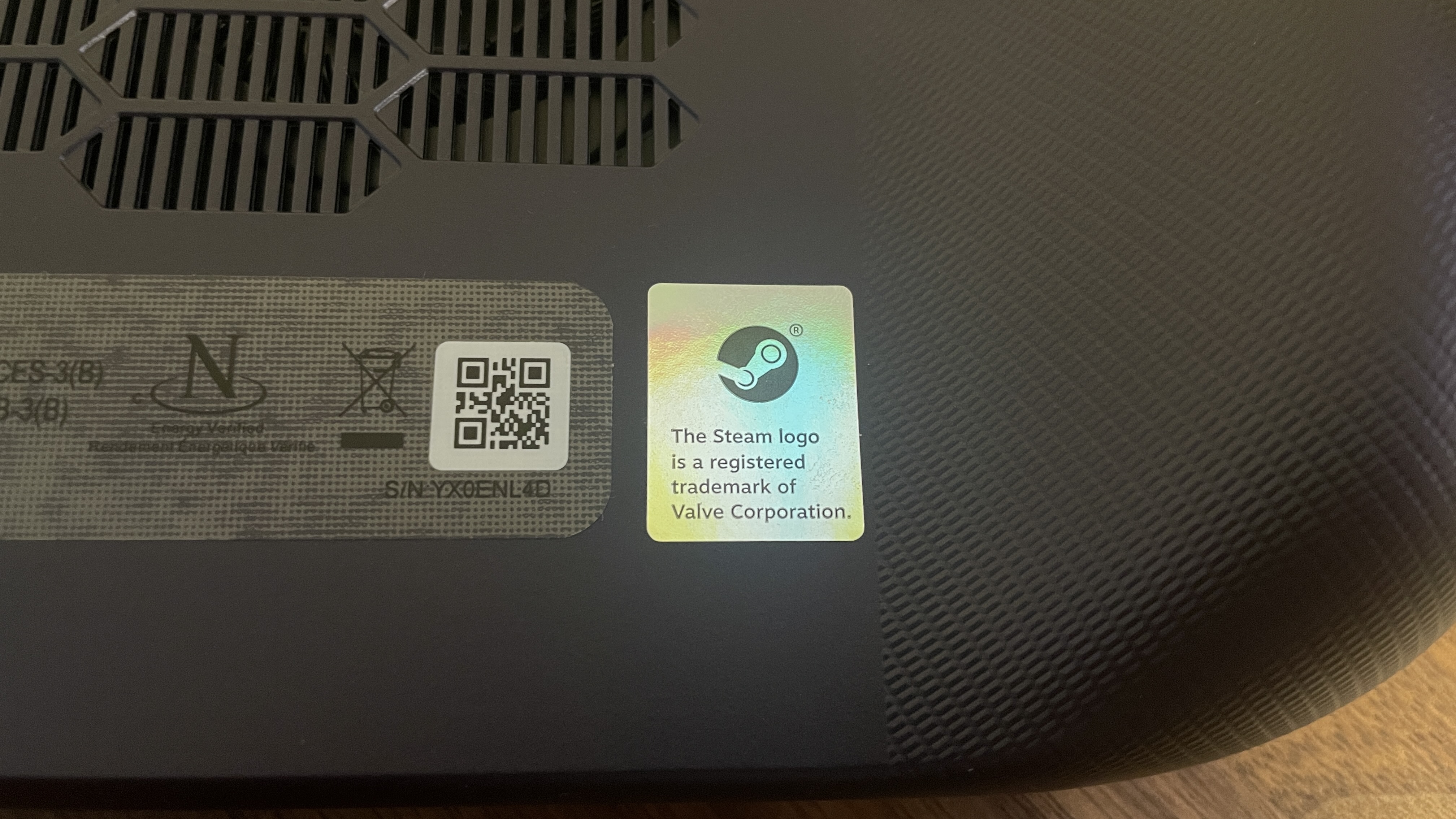 A Lenovo Legion Go S handheld with SteamOS in Nebula Nocturne colour scheme, showing the Steam label