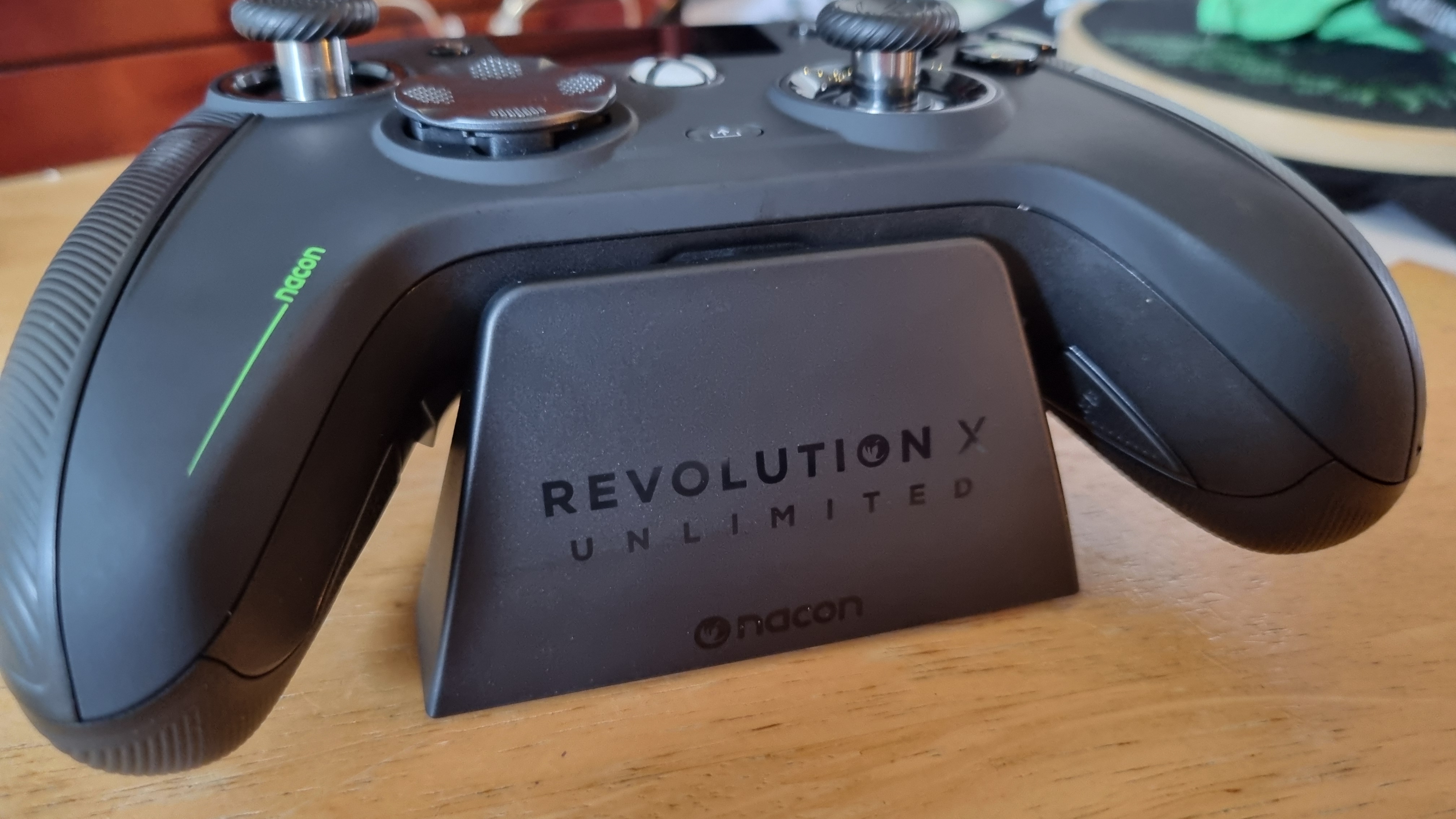 The Nacon Revolution X Unlimited on its charging stand