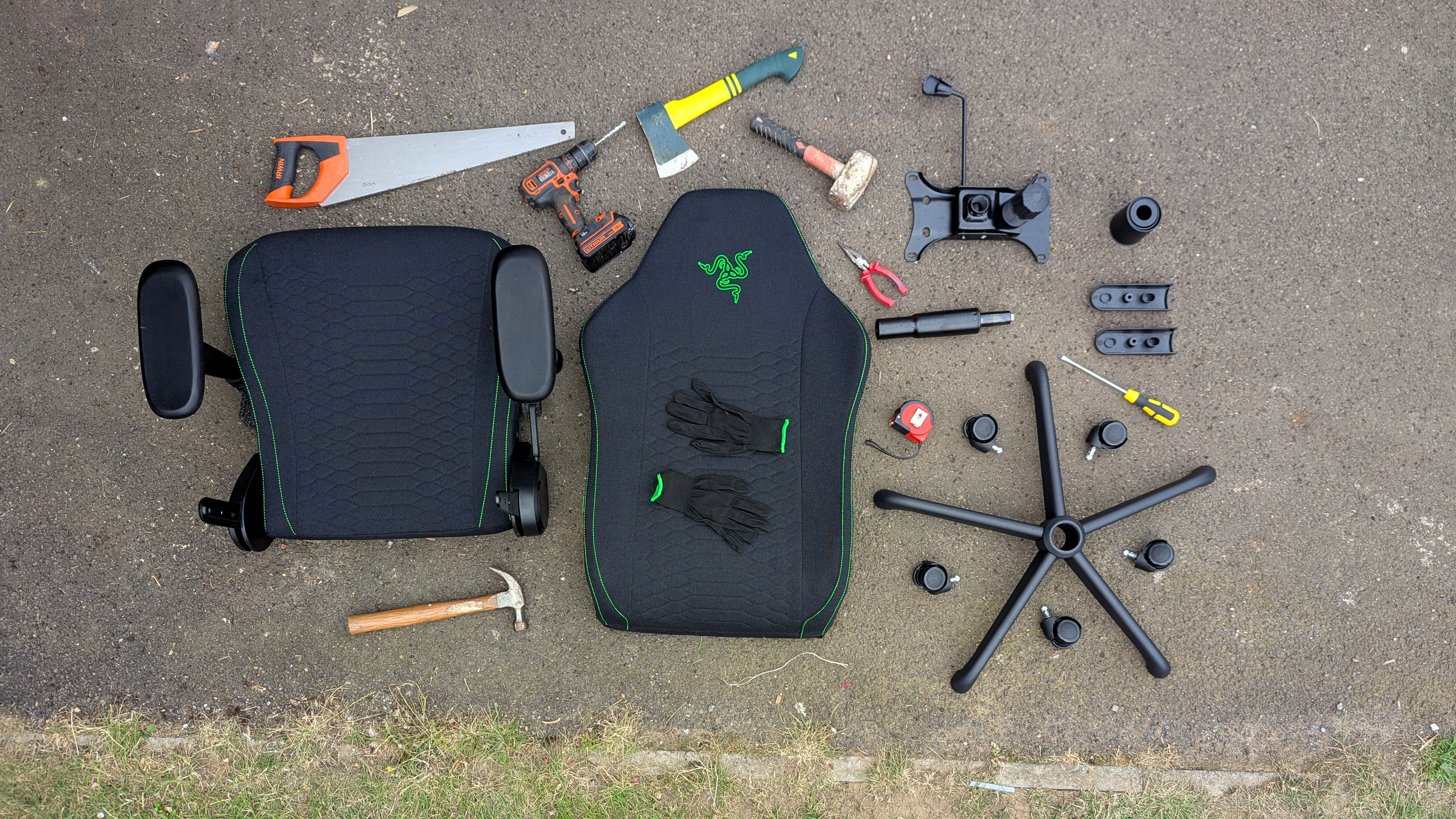 Razer Iskur V2 X gaming chair set-up outside with some Razer branded gloves!