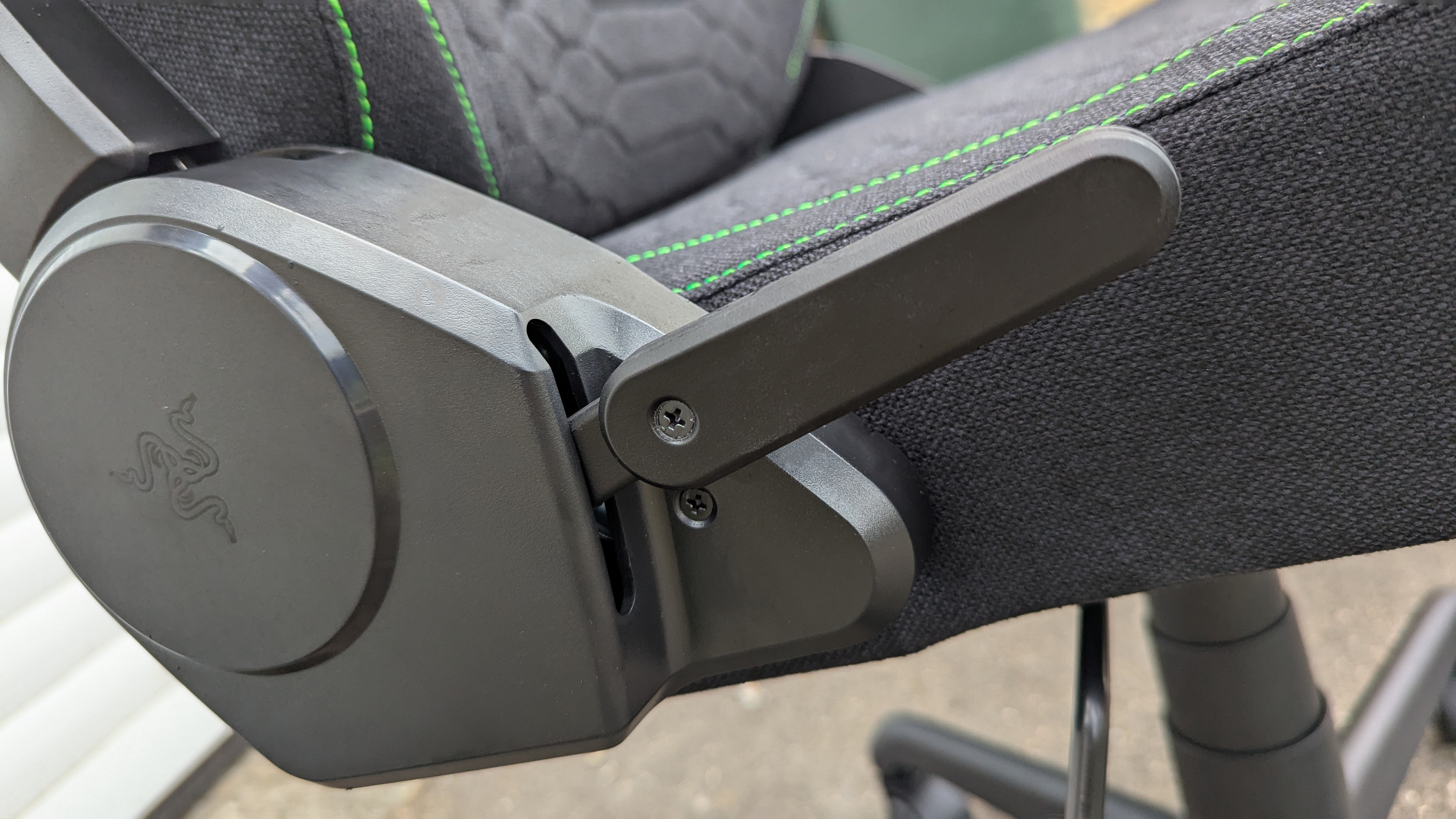 Razer Iskur V2 X gaming chair set-up outside with some Razer branded gloves!