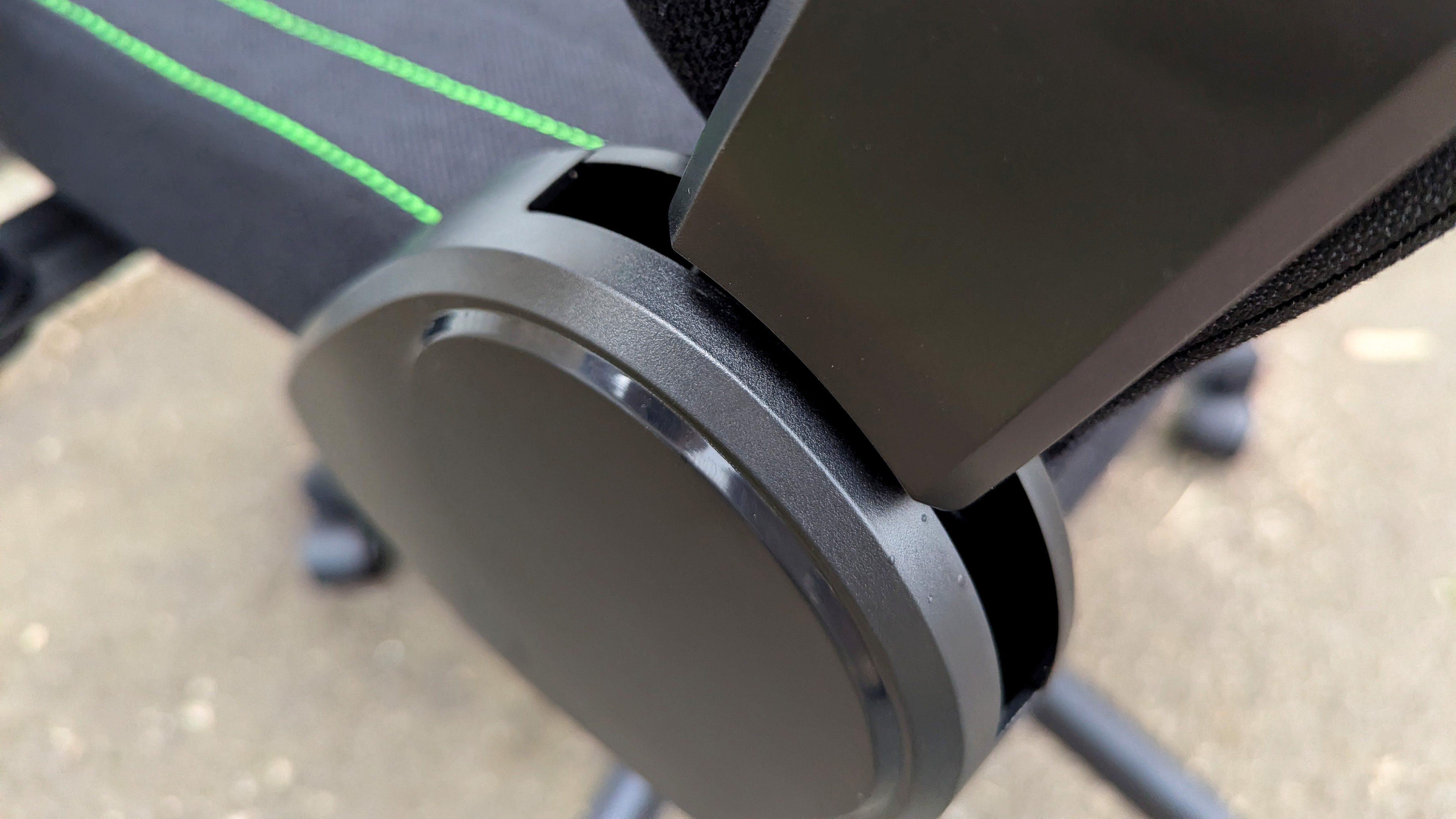 Razer Iskur V2 X gaming chair set-up outside with some Razer branded gloves!