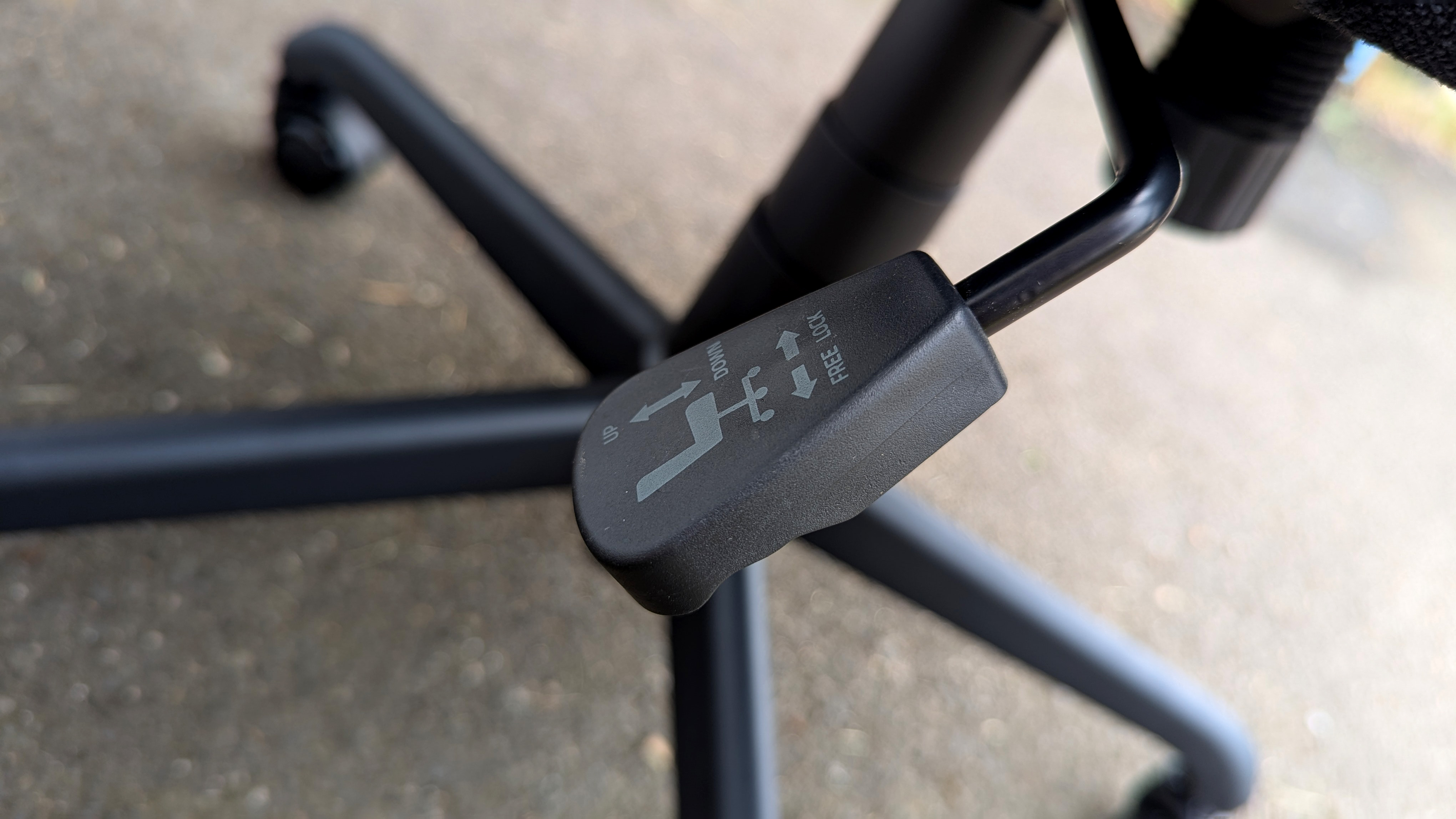 Razer Iskur V2 X gaming chair set-up outside with some Razer branded gloves!