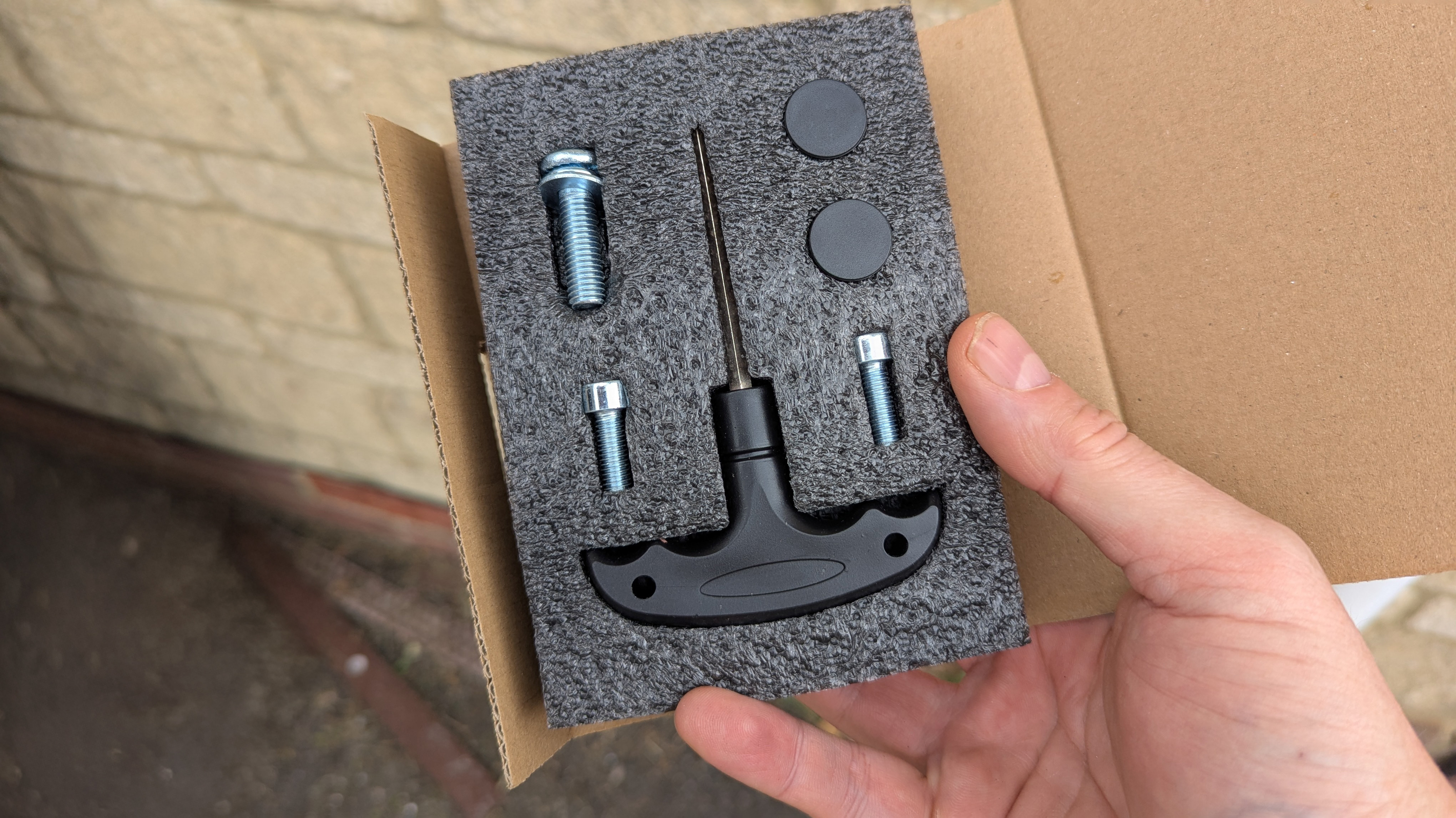 Razer Iskur V2 X gaming chair set-up outside with some Razer branded gloves!