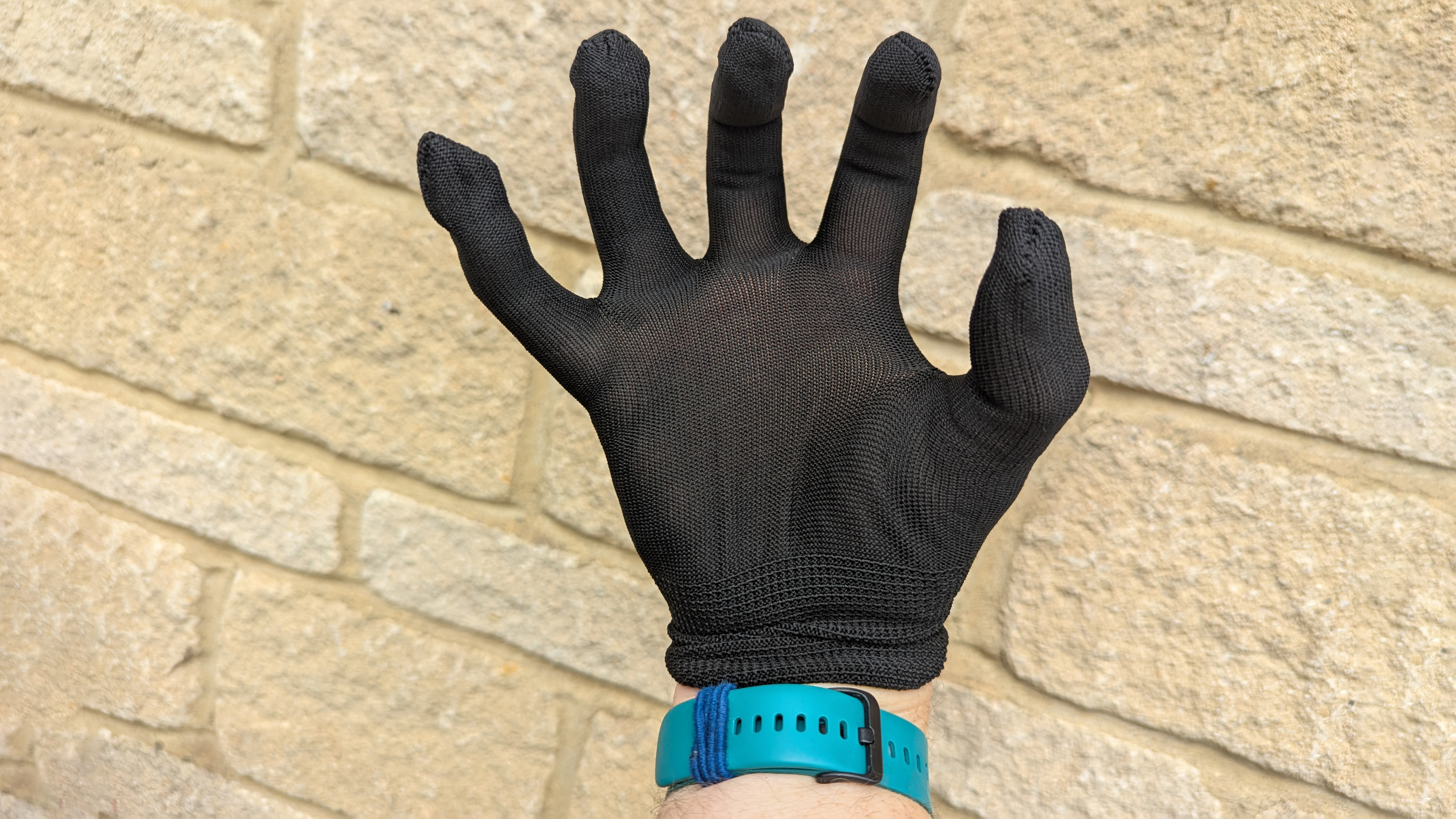 Razer Iskur V2 X gaming chair set-up outside with some Razer branded gloves!