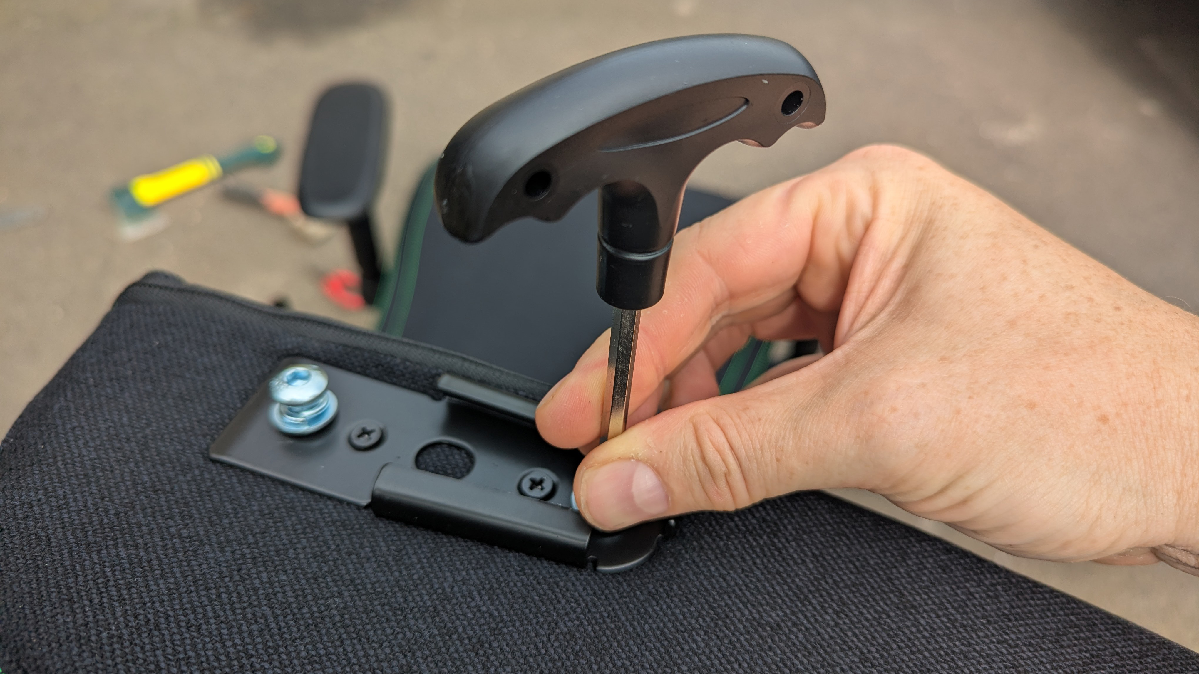 Razer Iskur V2 X gaming chair set-up outside with some Razer branded gloves!