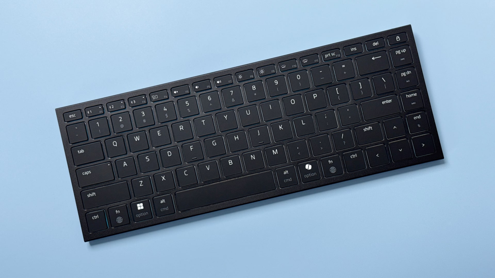 A Razer Basilisk Mobile gaming mouse and Razer Joro portable gaming keyboard on a blue background.