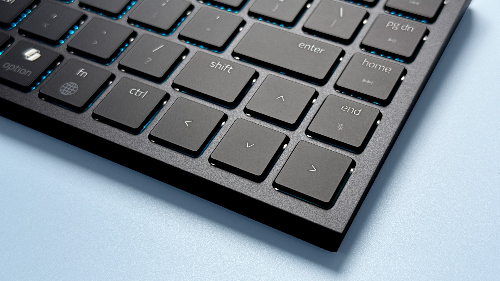 A Razer Basilisk Mobile gaming mouse and Razer Joro portable gaming keyboard on a blue background.