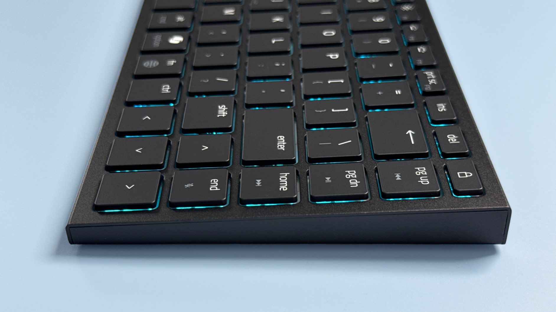 A Razer Basilisk Mobile gaming mouse and Razer Joro portable gaming keyboard on a blue background.