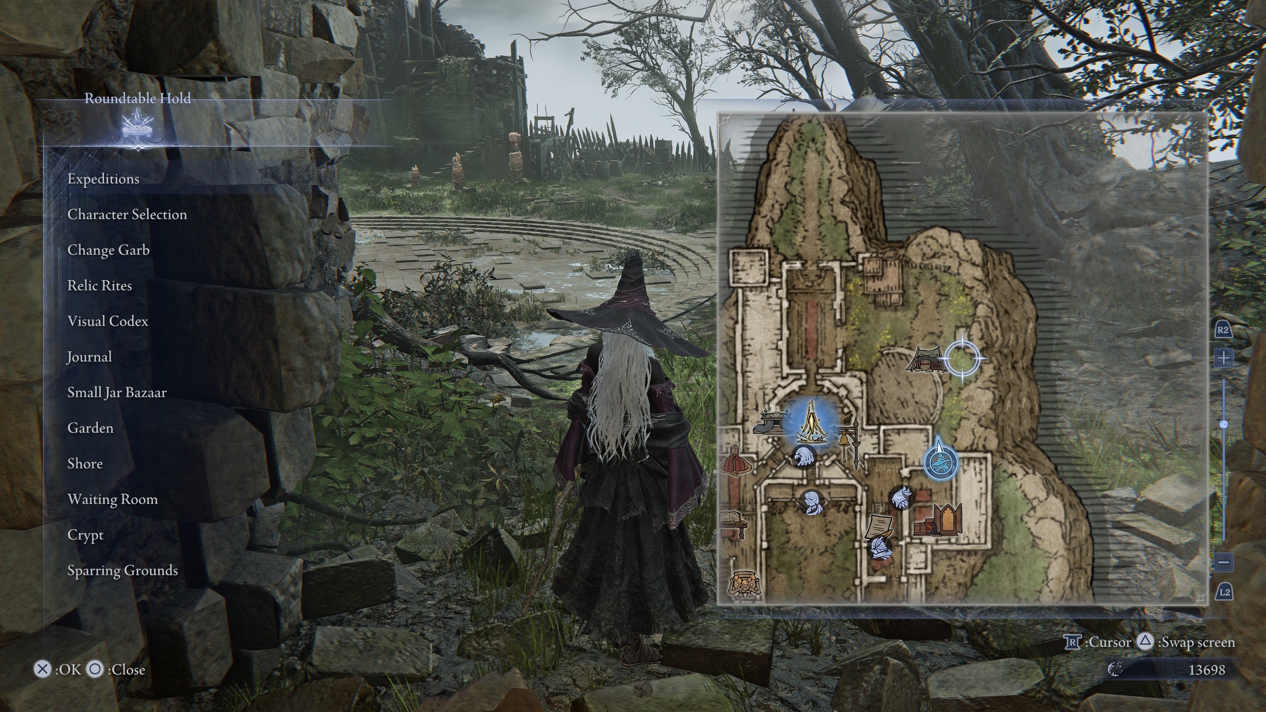 The Recluse in Elden Ring Nightreign, standing in the Rountable Hold’s training grounds where the lurking presence is