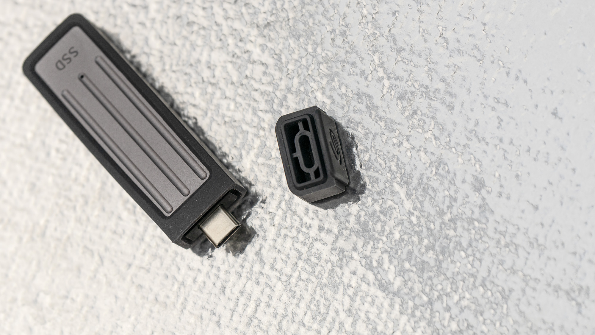 Seagate Ultra Compact SSD on a glass background.