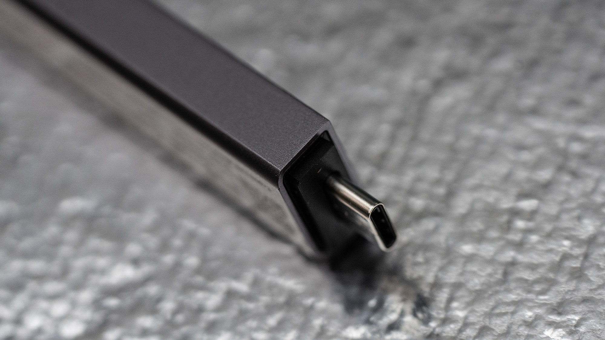 Seagate Ultra Compact SSD on a glass background.