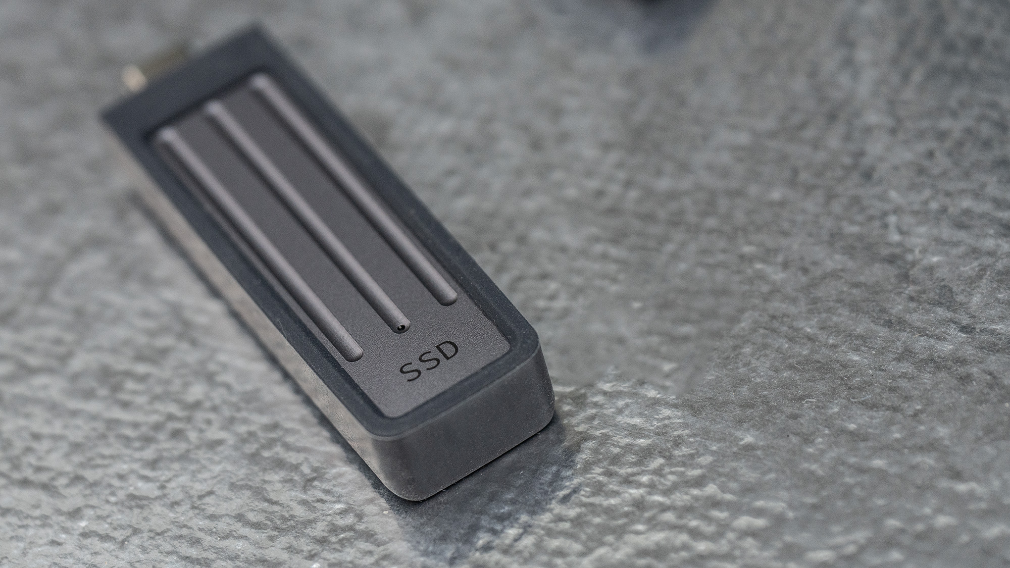 Seagate Ultra Compact SSD on a glass background.