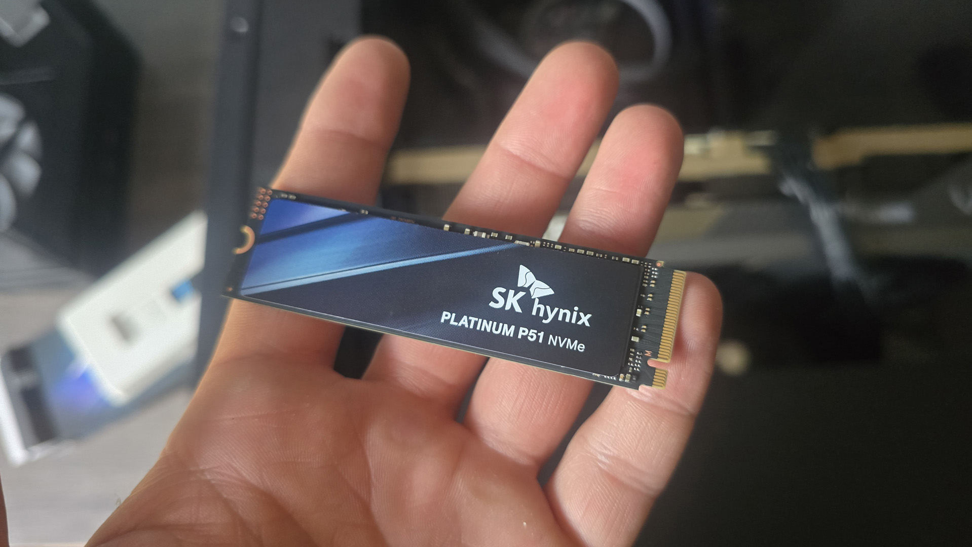 An SK Hynix Platinum P51 drive installed inside a gaming PC.