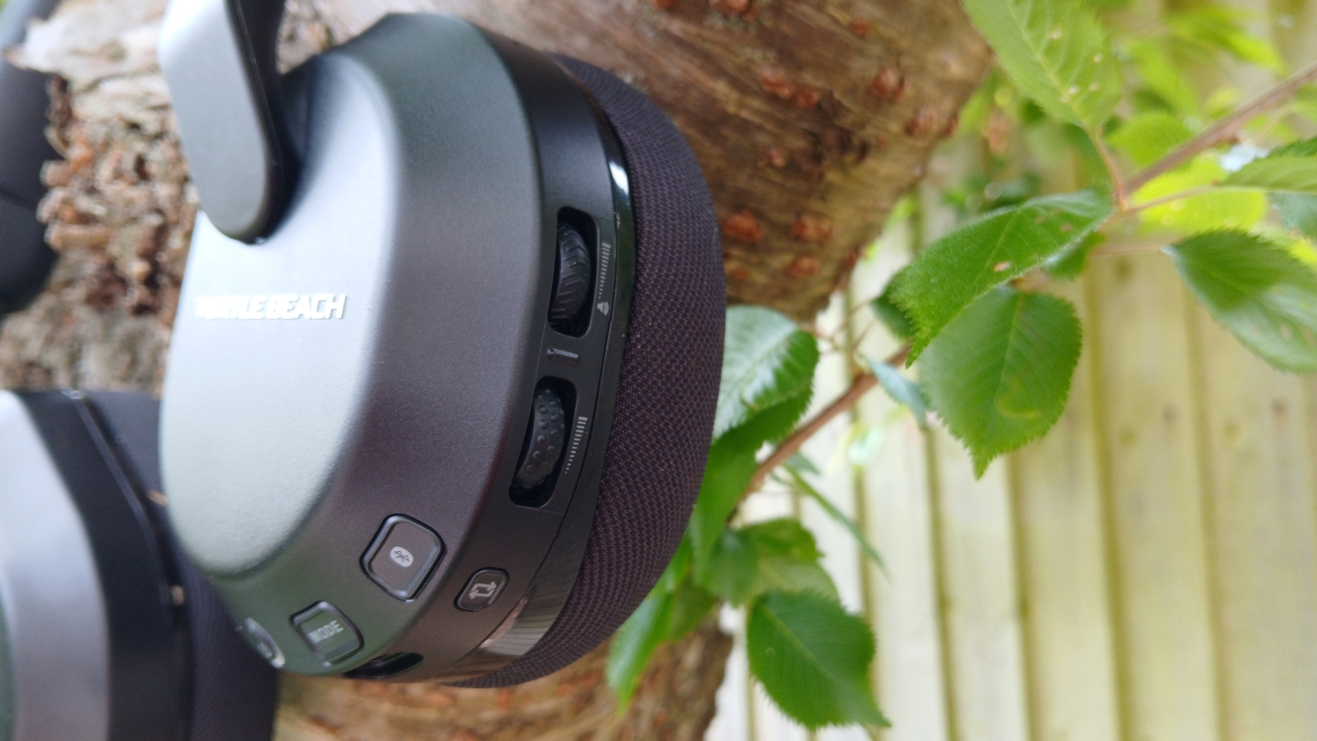 The Turtle Beach Stealth 600 gaming headset outside with the microphone and buttons on show.