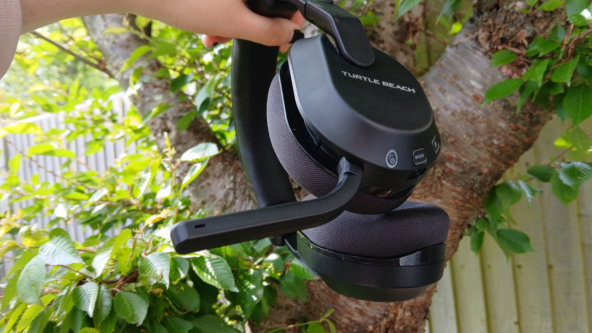 The Turtle Beach Stealth 600 gaming headset outside with the microphone and buttons on show.