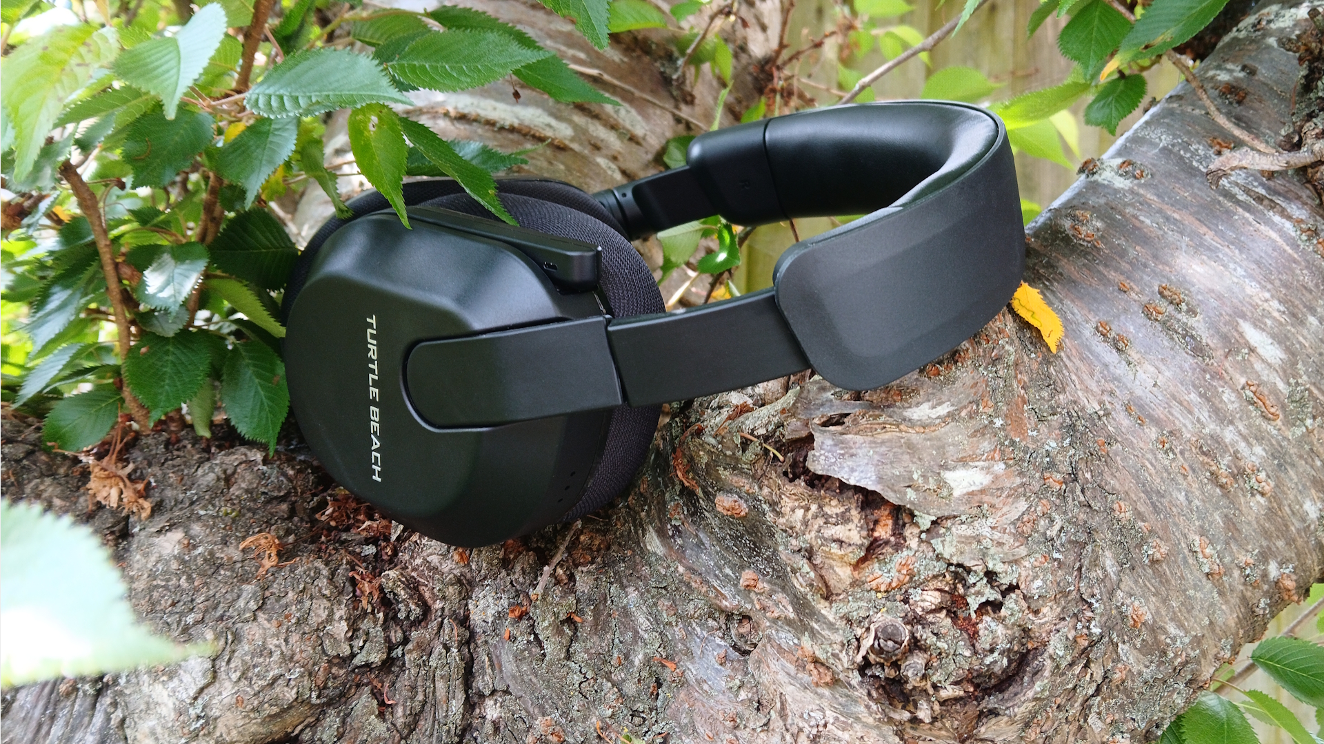 The Turtle Beach Stealth 600 gaming headset outside with the microphone and buttons on show.