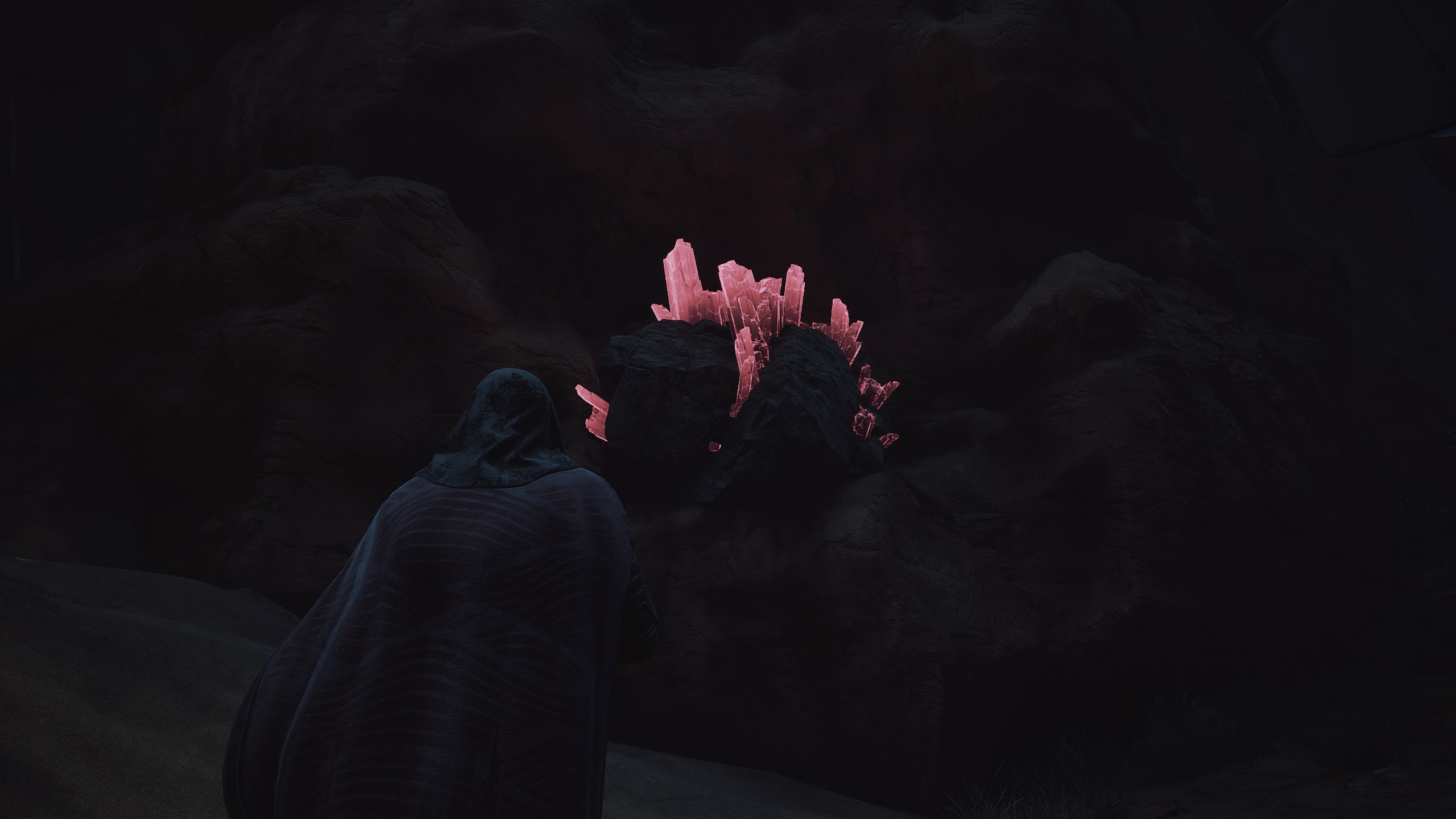 A Dune Awakening character standing near Erythrite Crystals