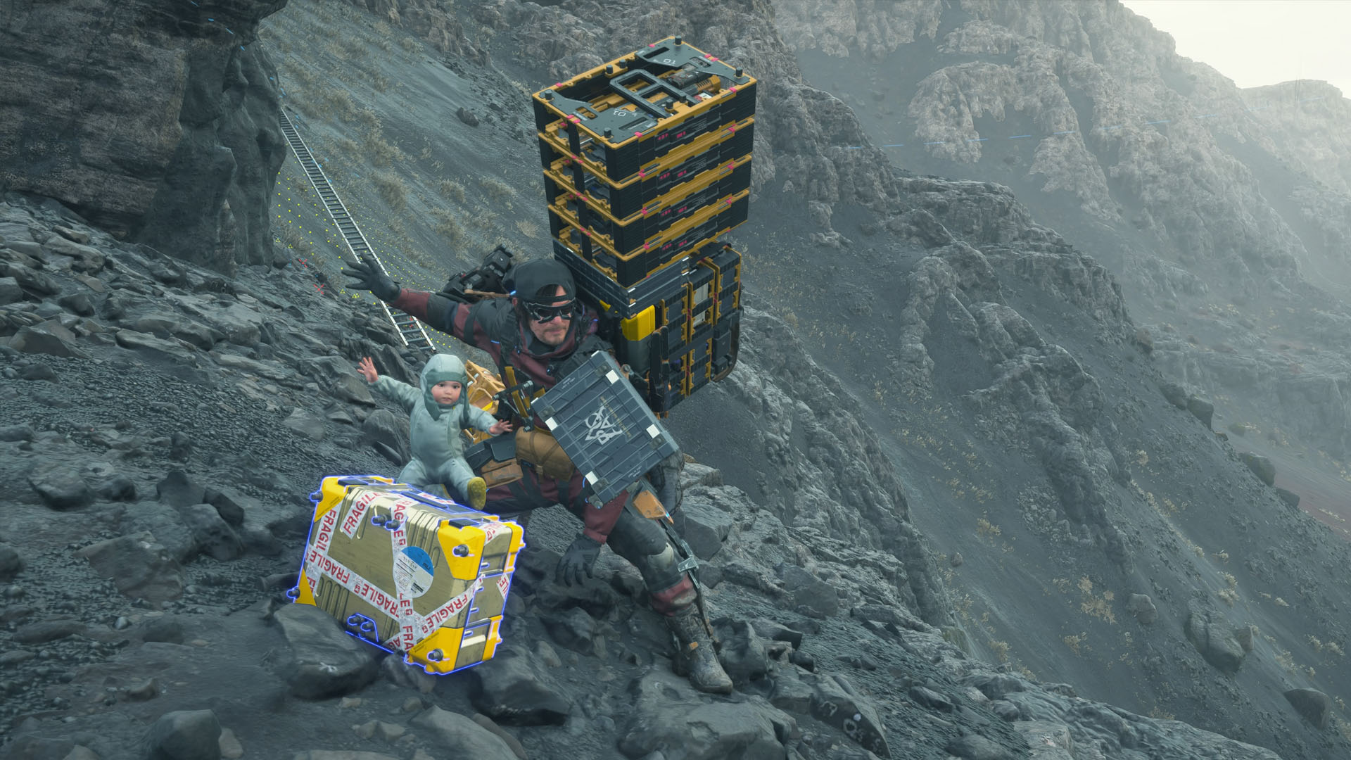 A Death Stranding 2 screenshot showing Sam posing with a baby with their arms open beside a shiny yellow box. A Death Stranding 2 screenshot showing Sam posing with a baby with their arms open beside a shiny yellow box.