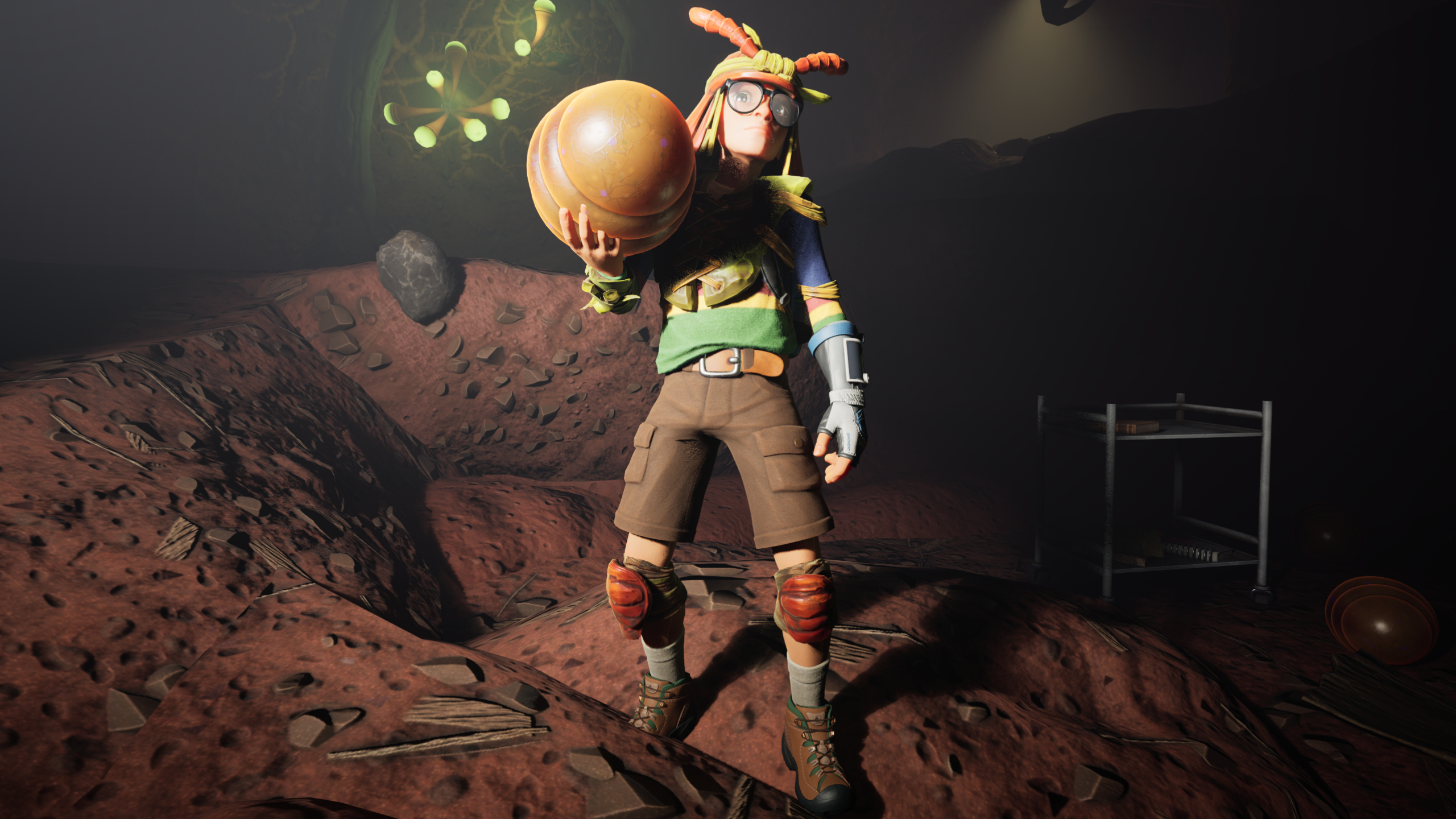 Grounded 2 Buggies: A character holding a red soldier ant in their right hand while standing in a dark cave.