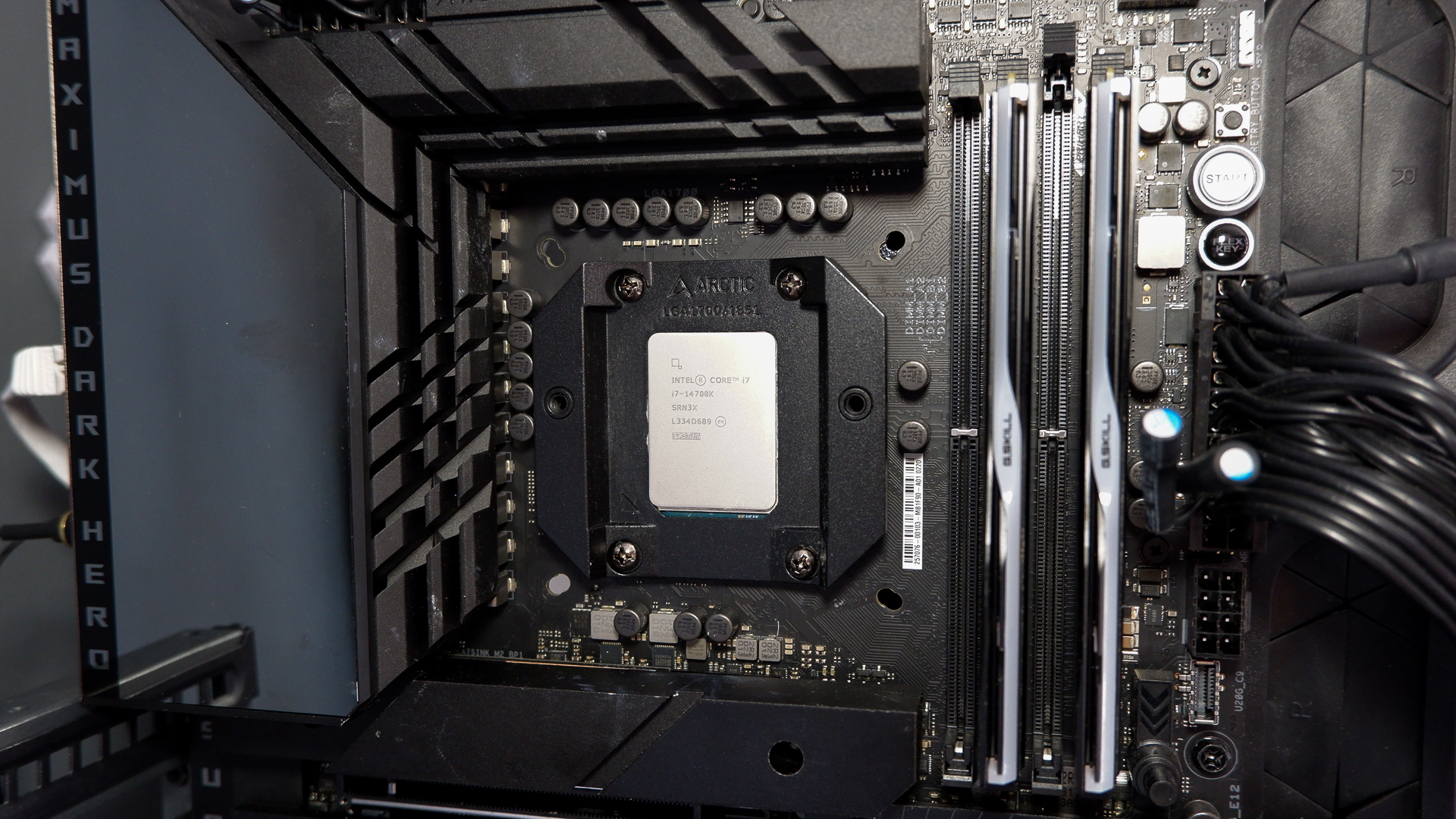 An Arctic Liquid Freezer III Pro liquid cooler set-up on a test bench with the RGB enabled.