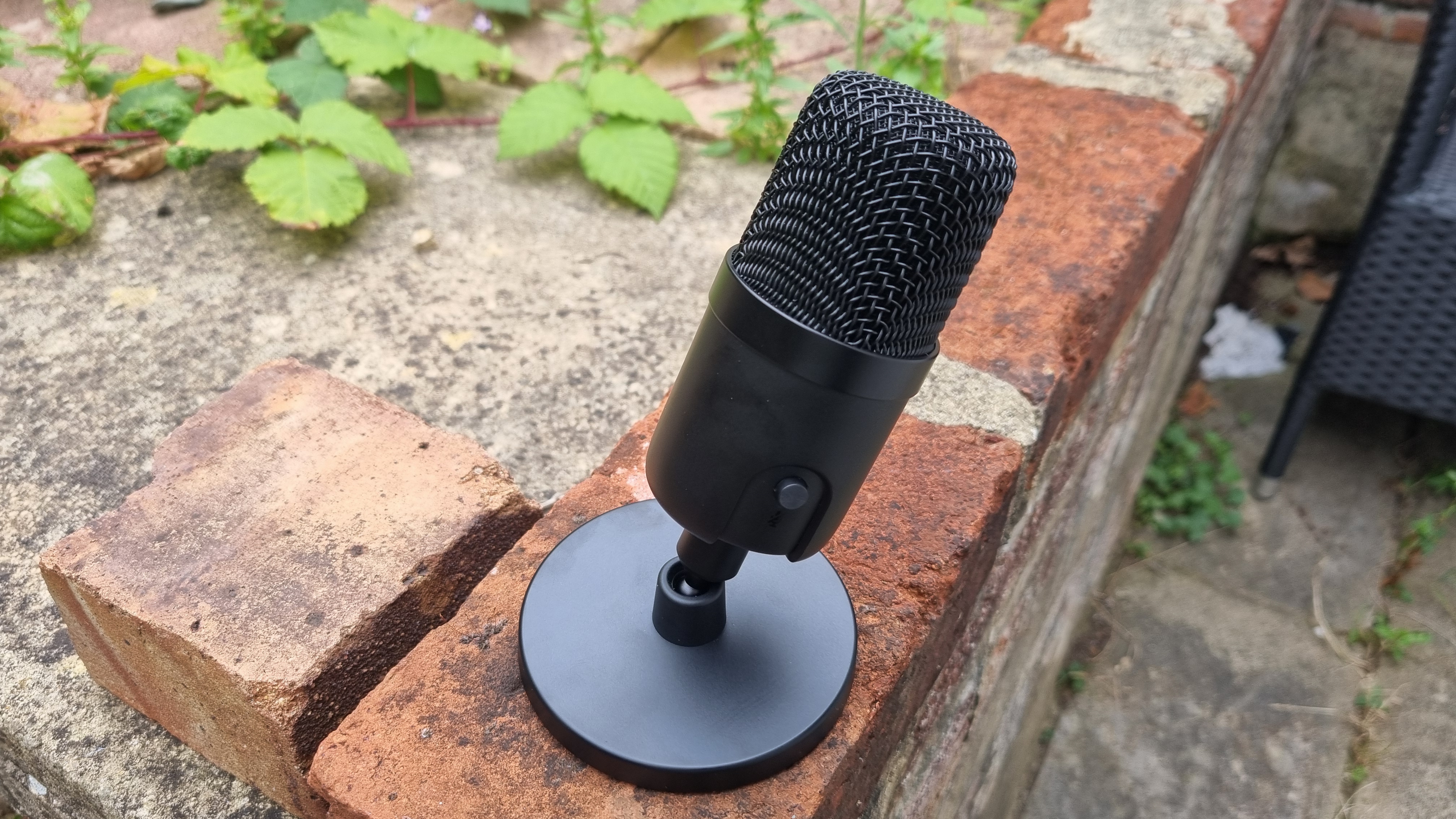 The Amazon Basics USB Condenser microphone leaning over