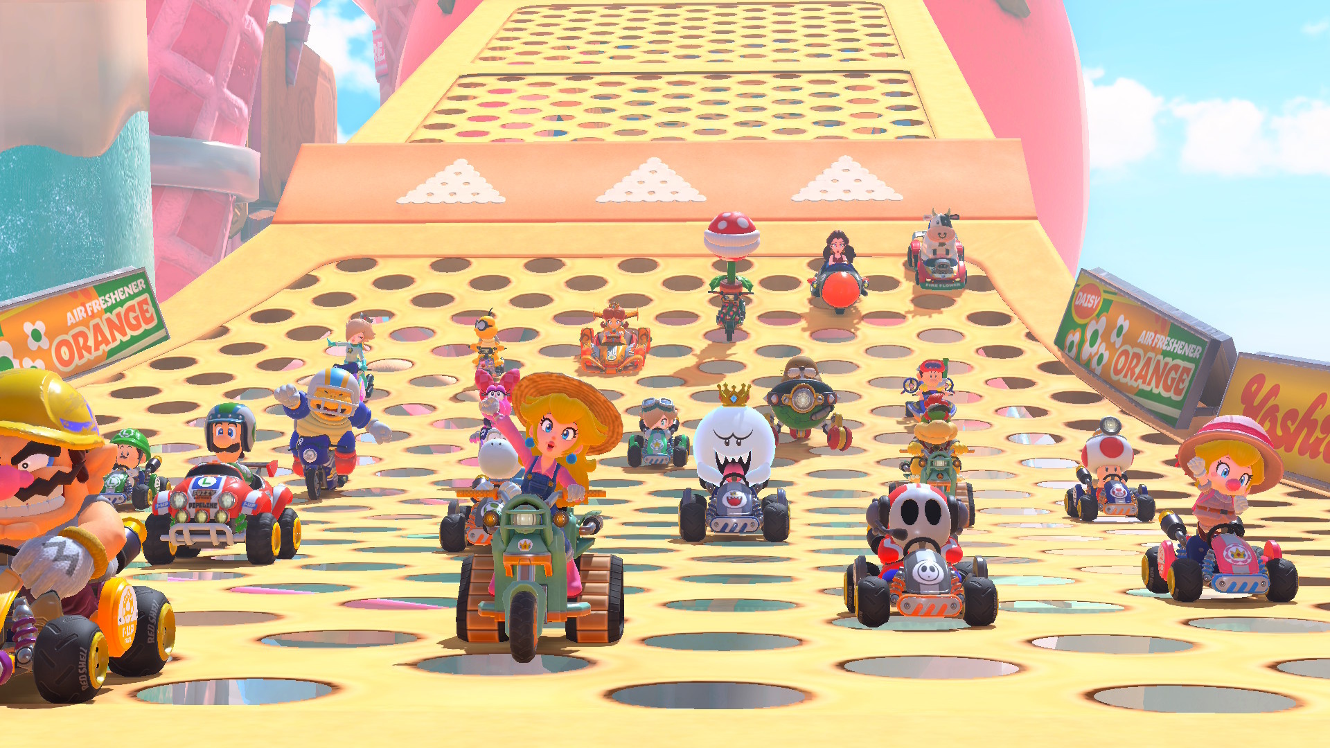A full set of 24 racers in Mario Kart World, with Peach and Wario in the lead A full set of 24 racers in Mario Kart World, with Peach and Wario in the lead
