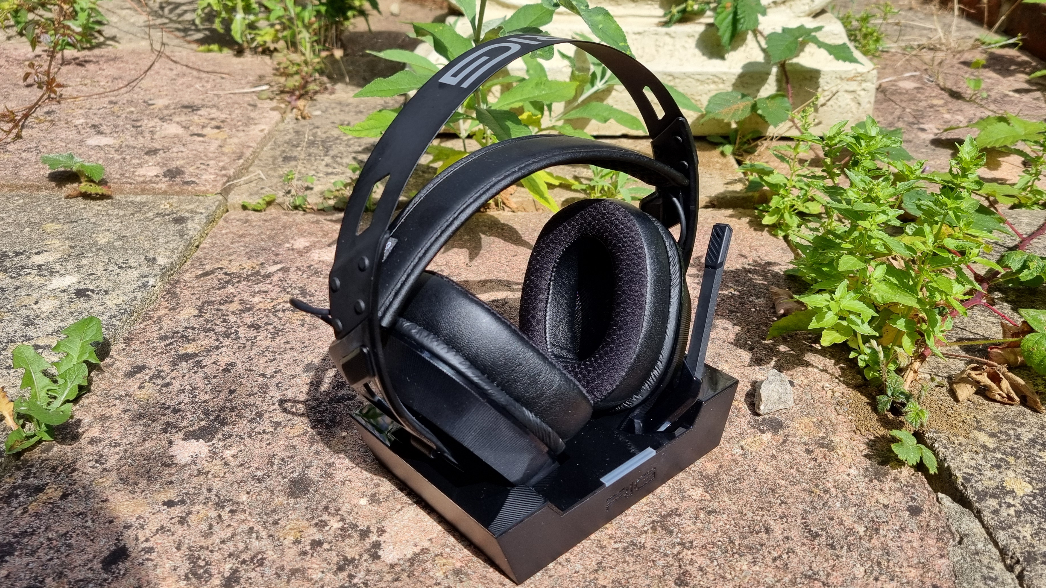 The Nacon RIG 900 Max HS on its charging cradle