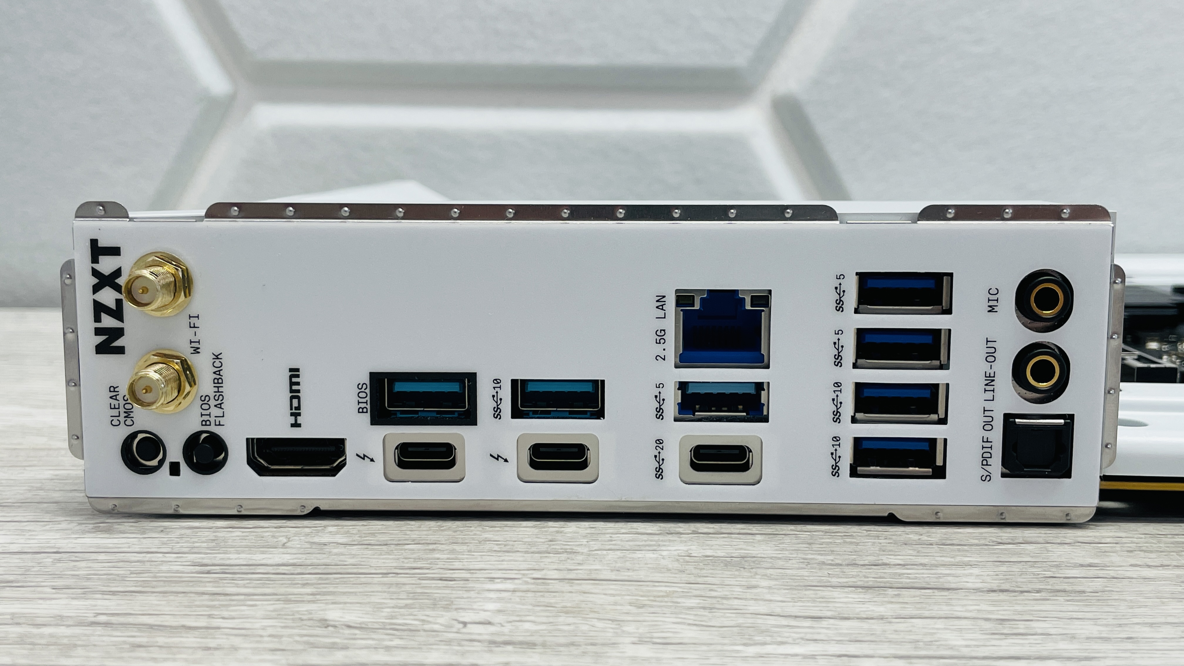 An NZXT N7 Z890 motherboard on a desk with port covers removed.