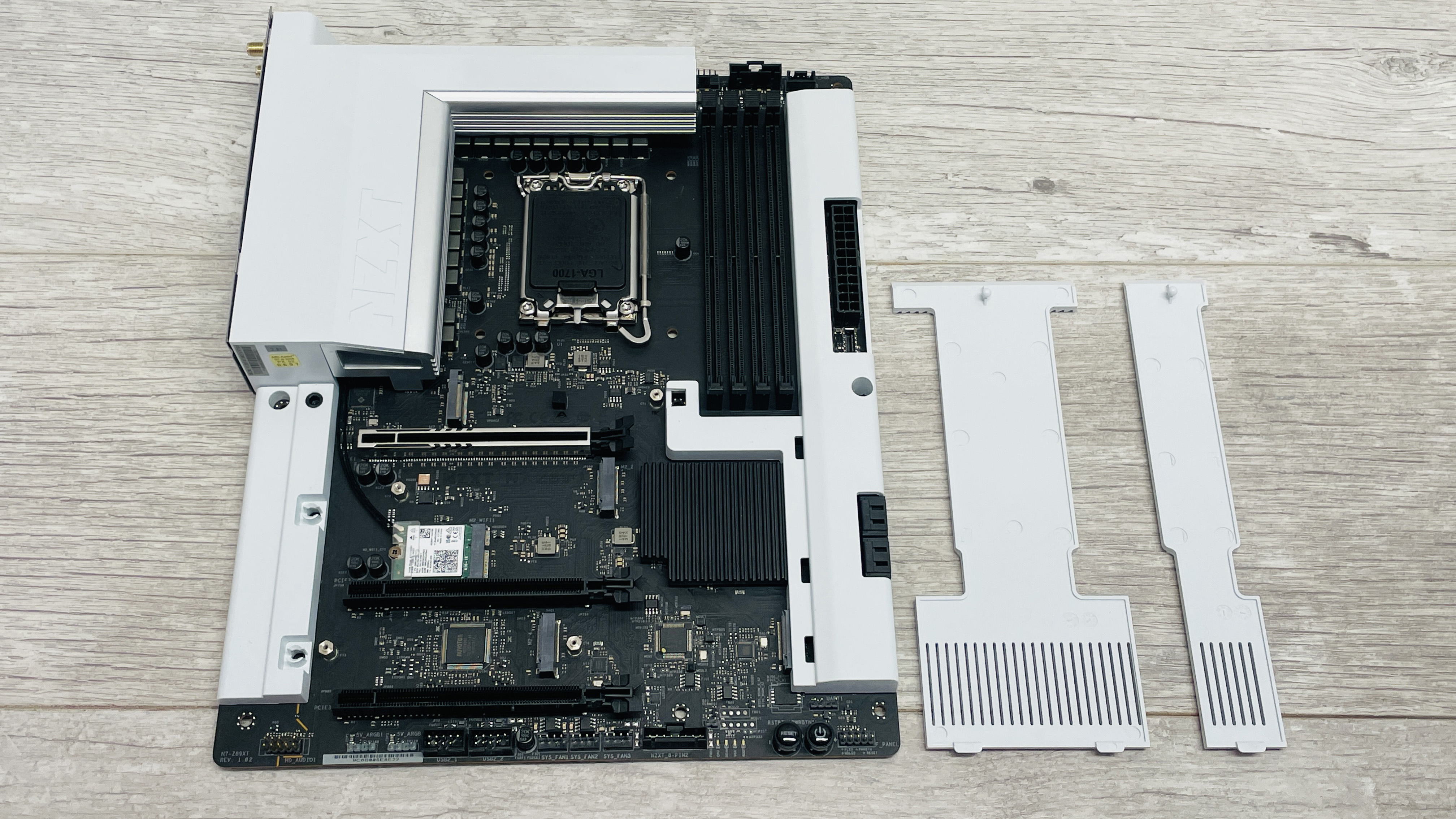 An NZXT N7 Z890 motherboard on a desk with port covers removed.