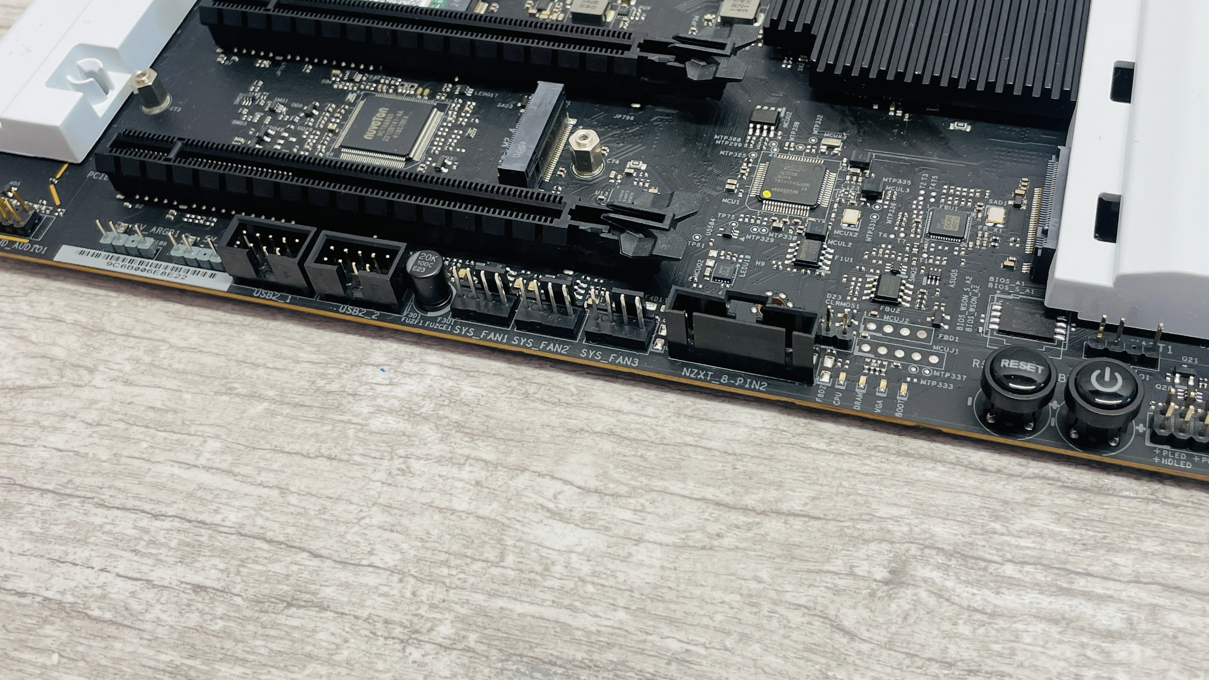 An NZXT N7 Z890 motherboard on a desk with port covers removed.
