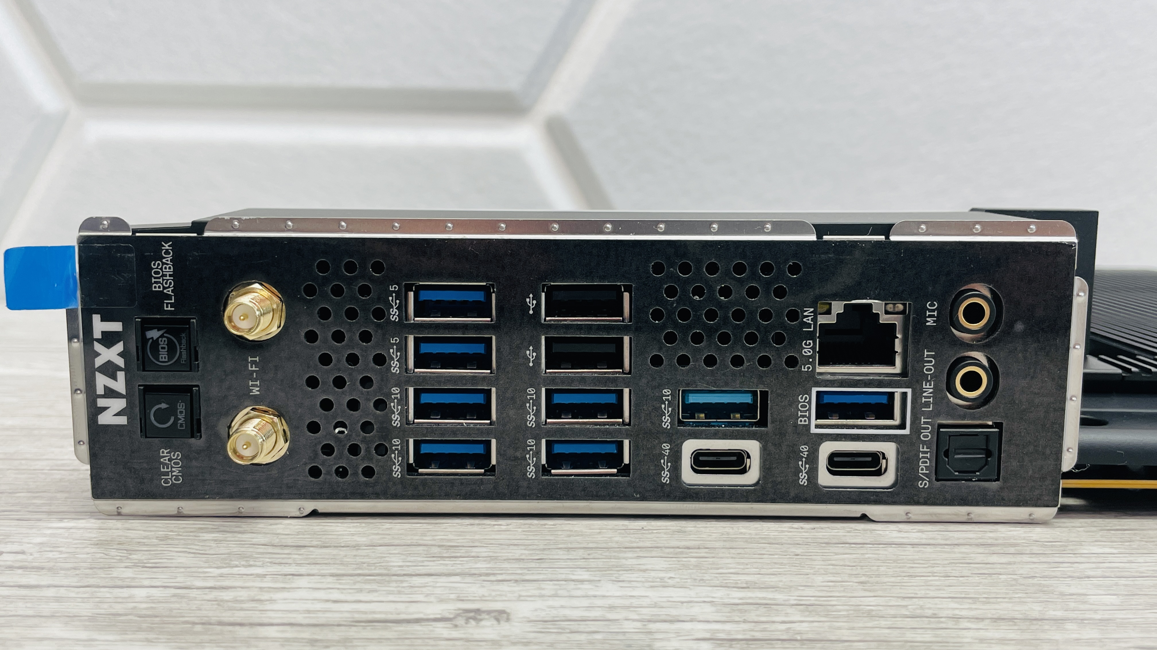 An NZXT N9 X870E motherboard in black with the port covers removed.