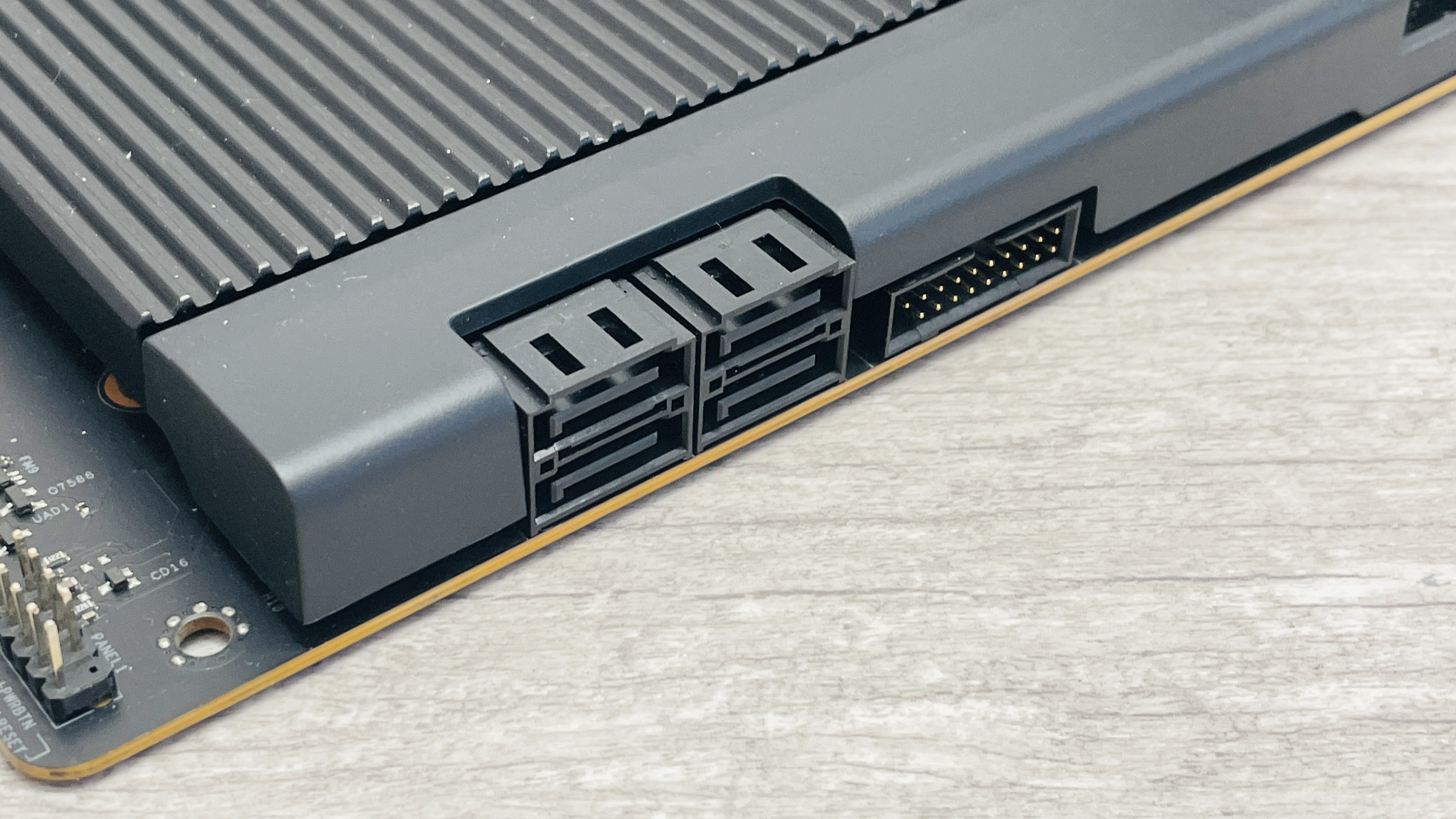 An NZXT N9 X870E motherboard in black with the port covers removed.